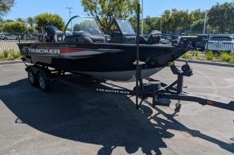 2026 Tracker Targa V-18 WT boat on trailer in sunny parking lot.
