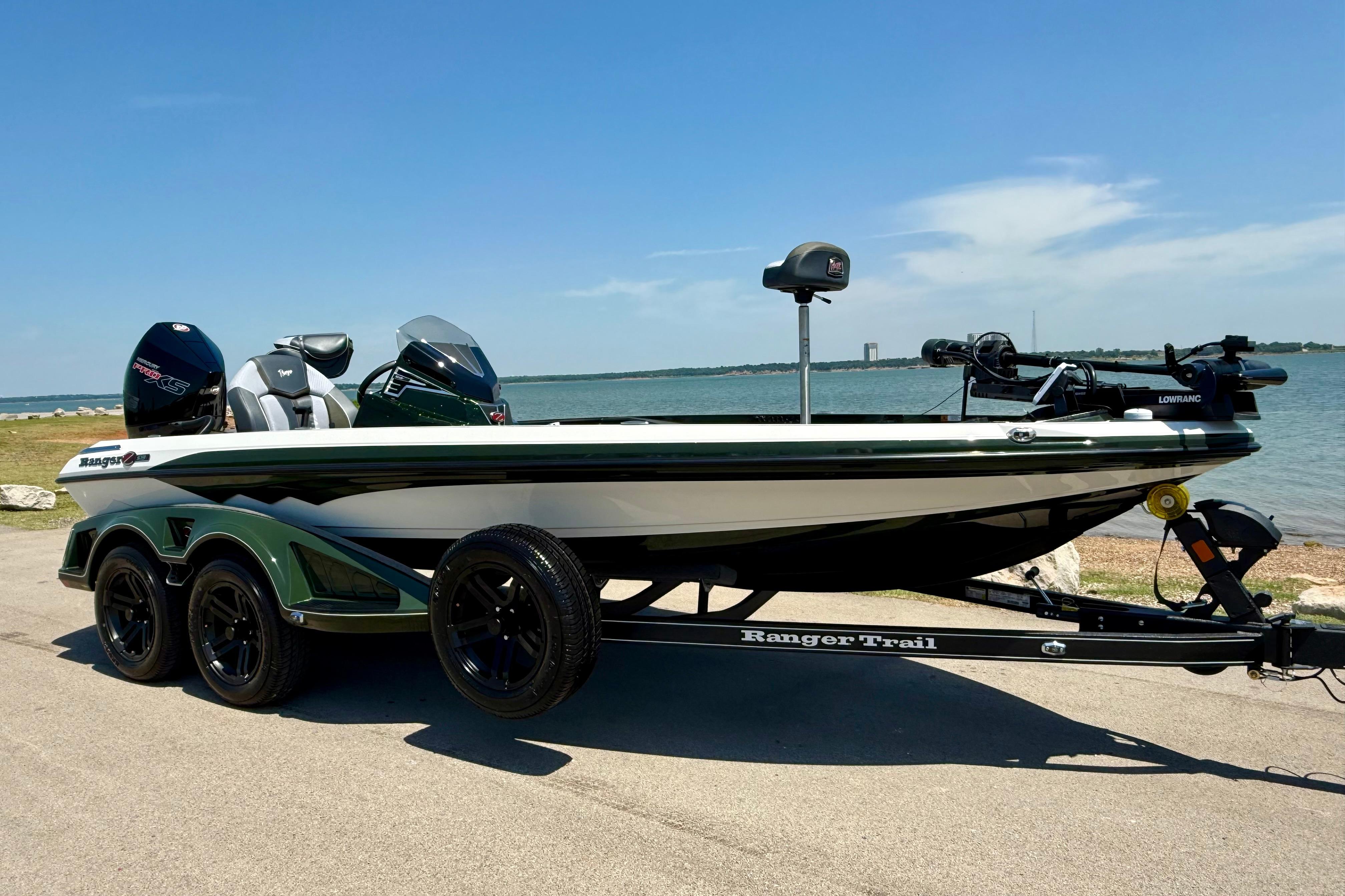 2026 Ranger Z519R boat on trailer by a lake under clear blue sky.