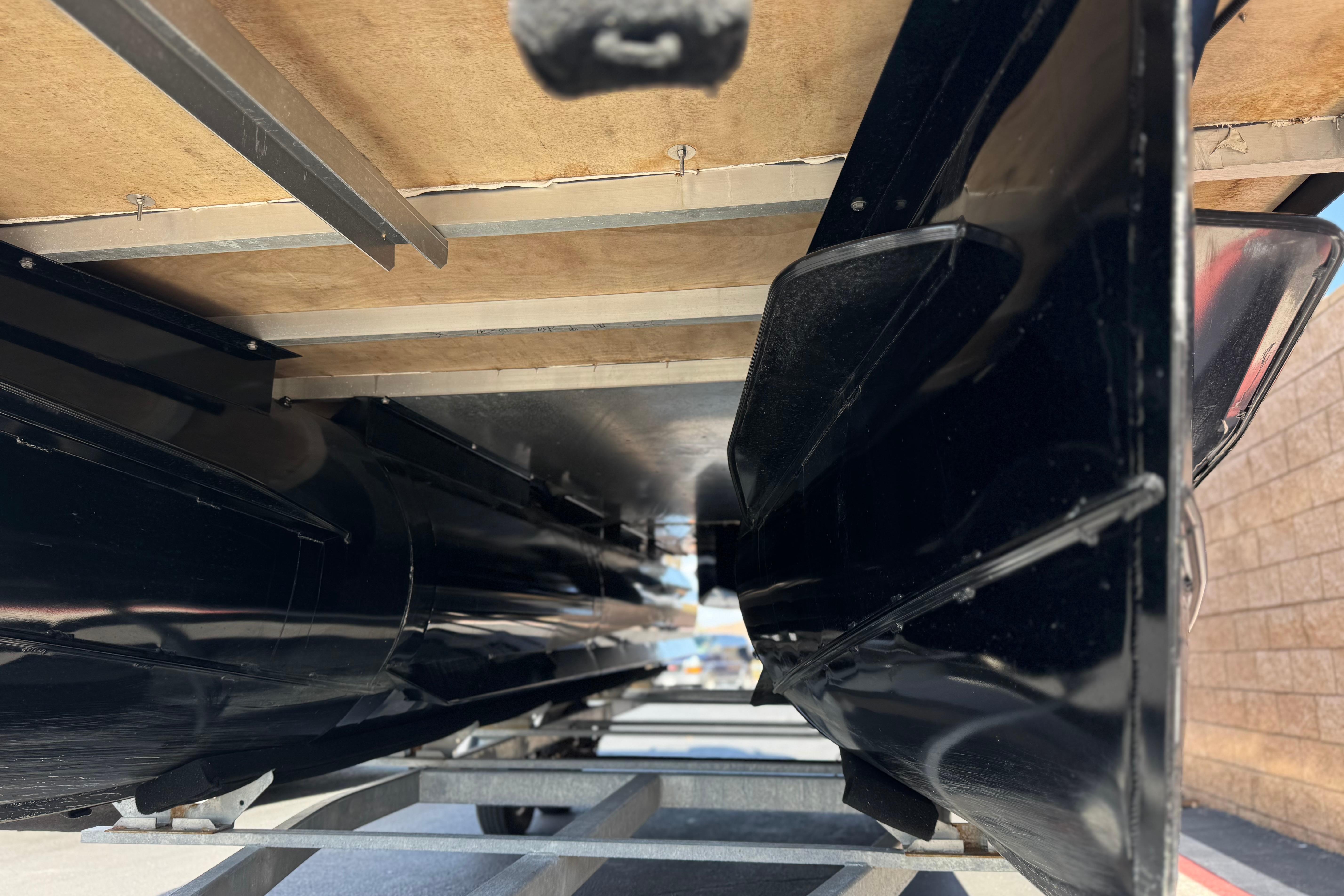 Underneath view of a 2023 Lexington 623 ST Xtreme boat on a trailer.