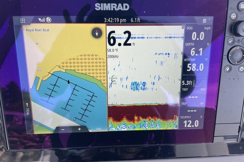 Simrad marine display on 2023 Robalo R270 Center Console showing depth and navigation data.