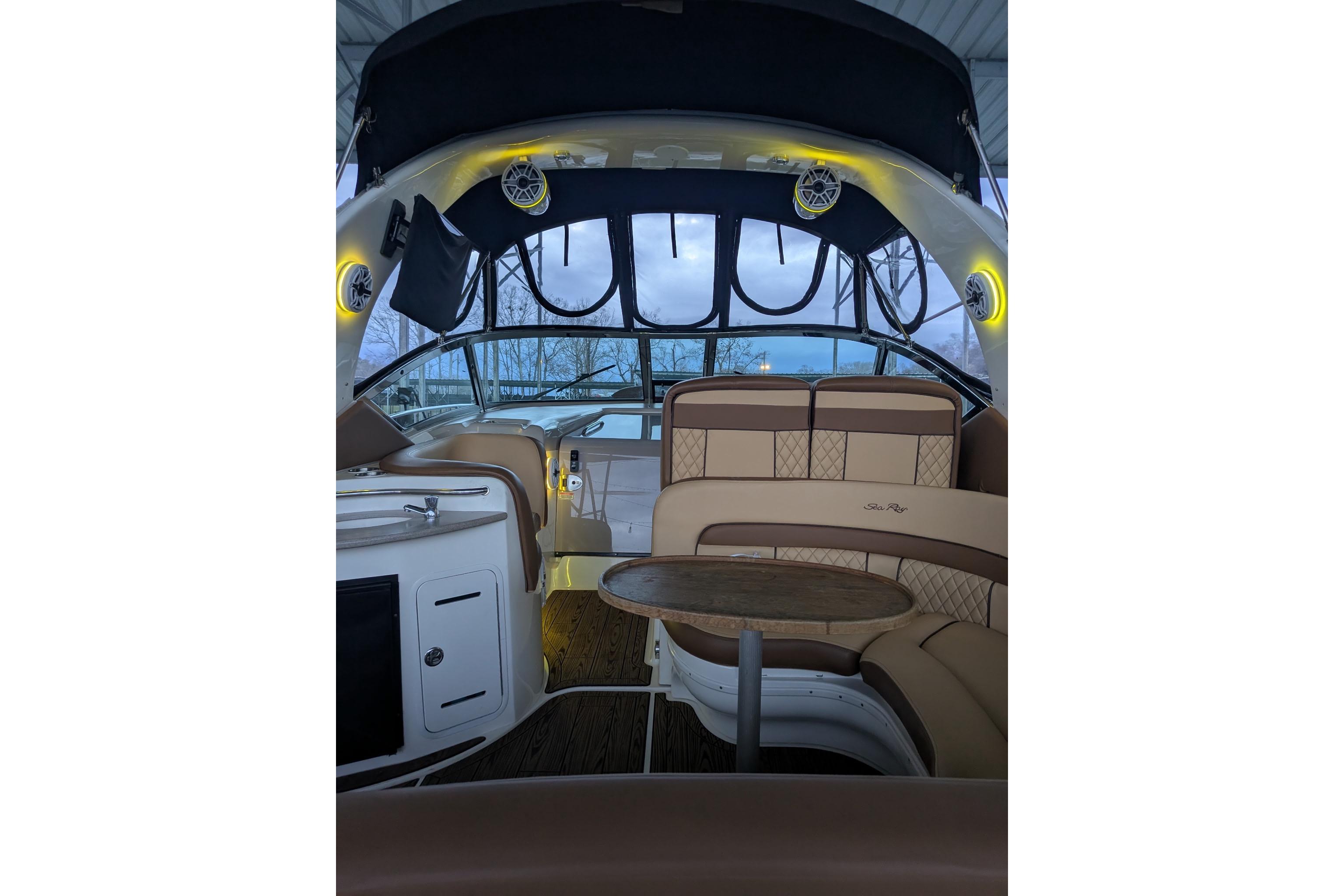 Interior of 2002 Sea Ray Sundancer 320 yacht with seating and table.