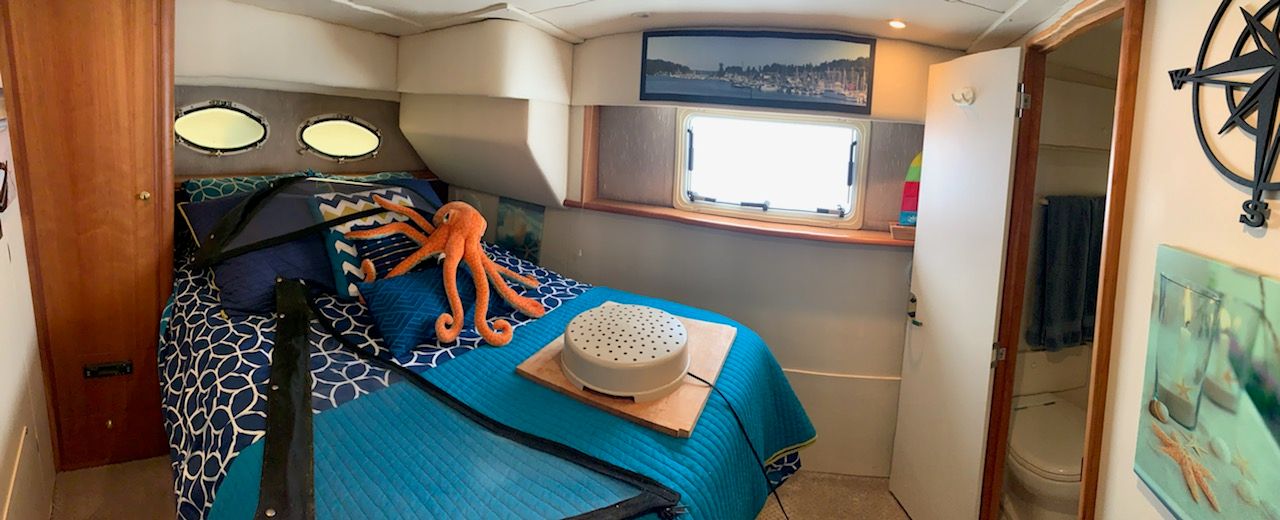 Interior of a 1998 Silverton 372/392 yacht featuring a cozy bedroom.