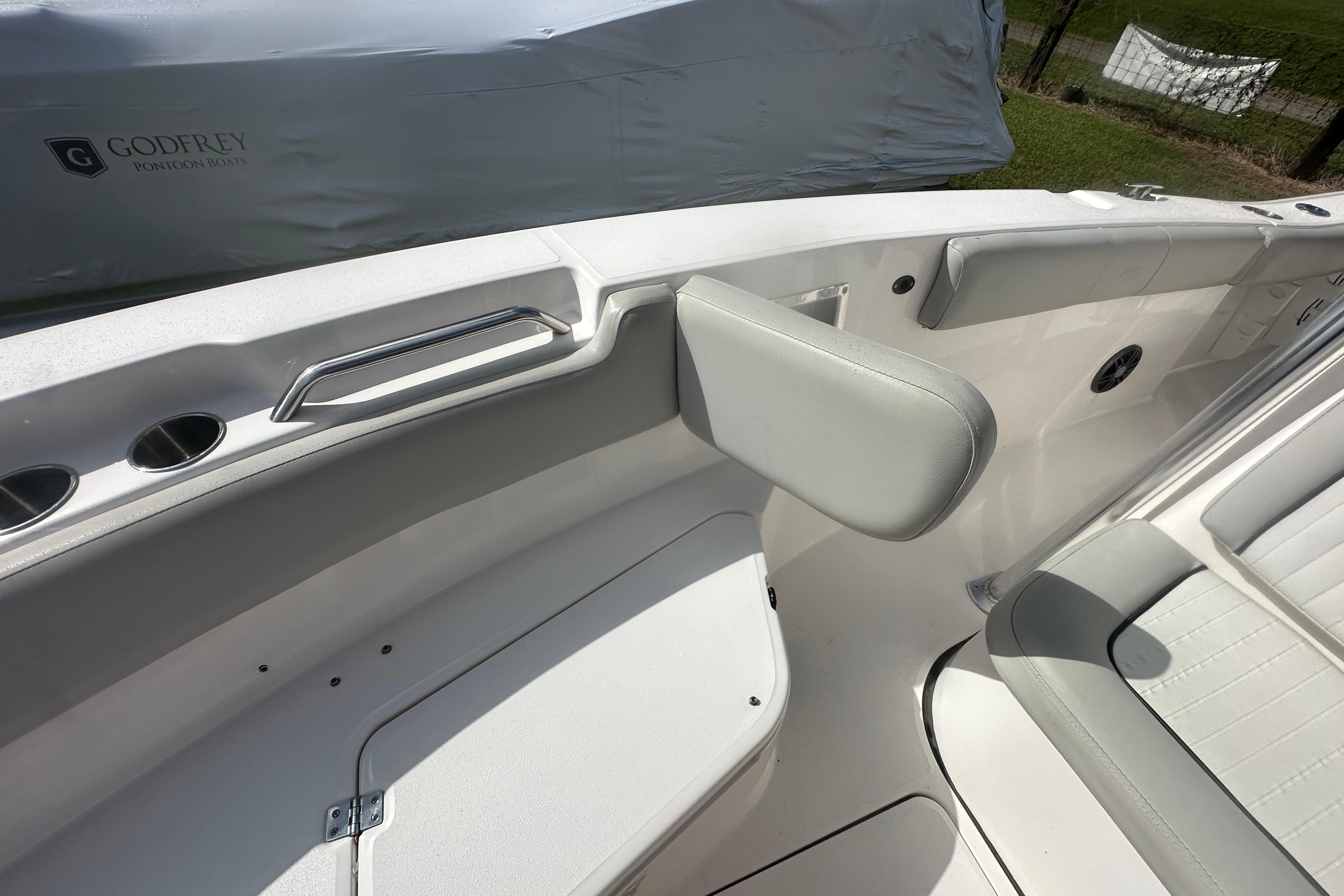 2023 Sea Fox 228 Commander boat interior with cushioned seating and storage compartments.