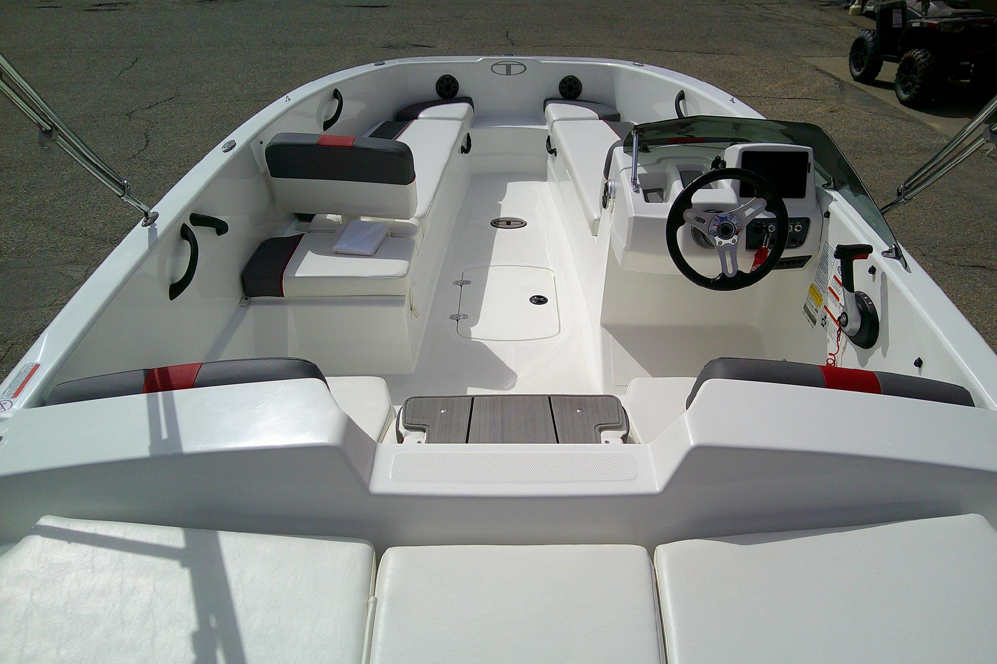 2024 Tahoe T18 boat interior with modern seating and steering console.