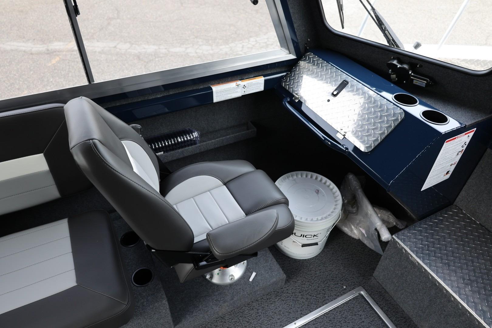 Interior of 2026 Thunder Jet 24 Alexis Pro boat with seating and storage compartments.