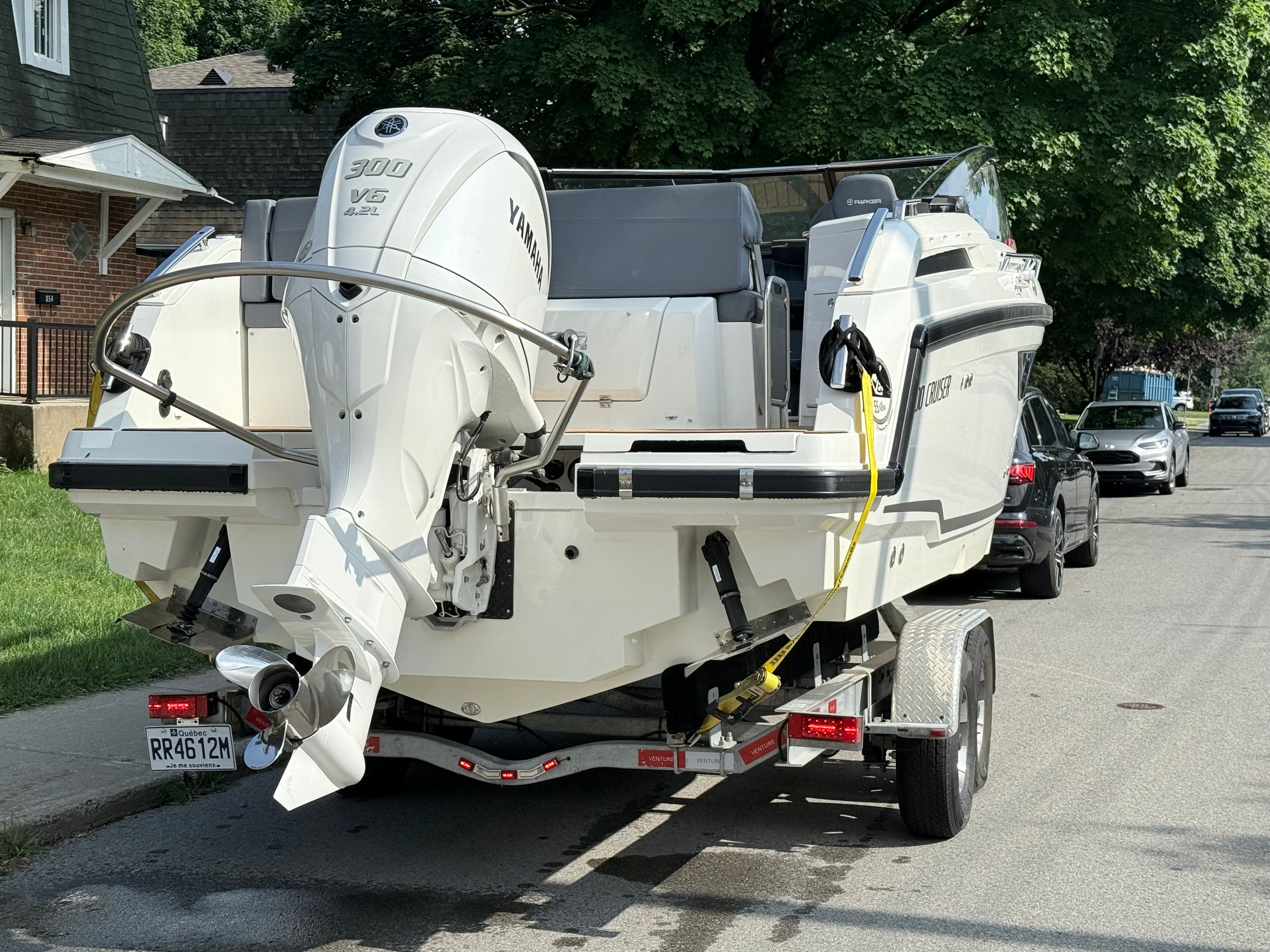 A 2022 Parker Poland 800 Cruiser on a trailer, parked on a street.