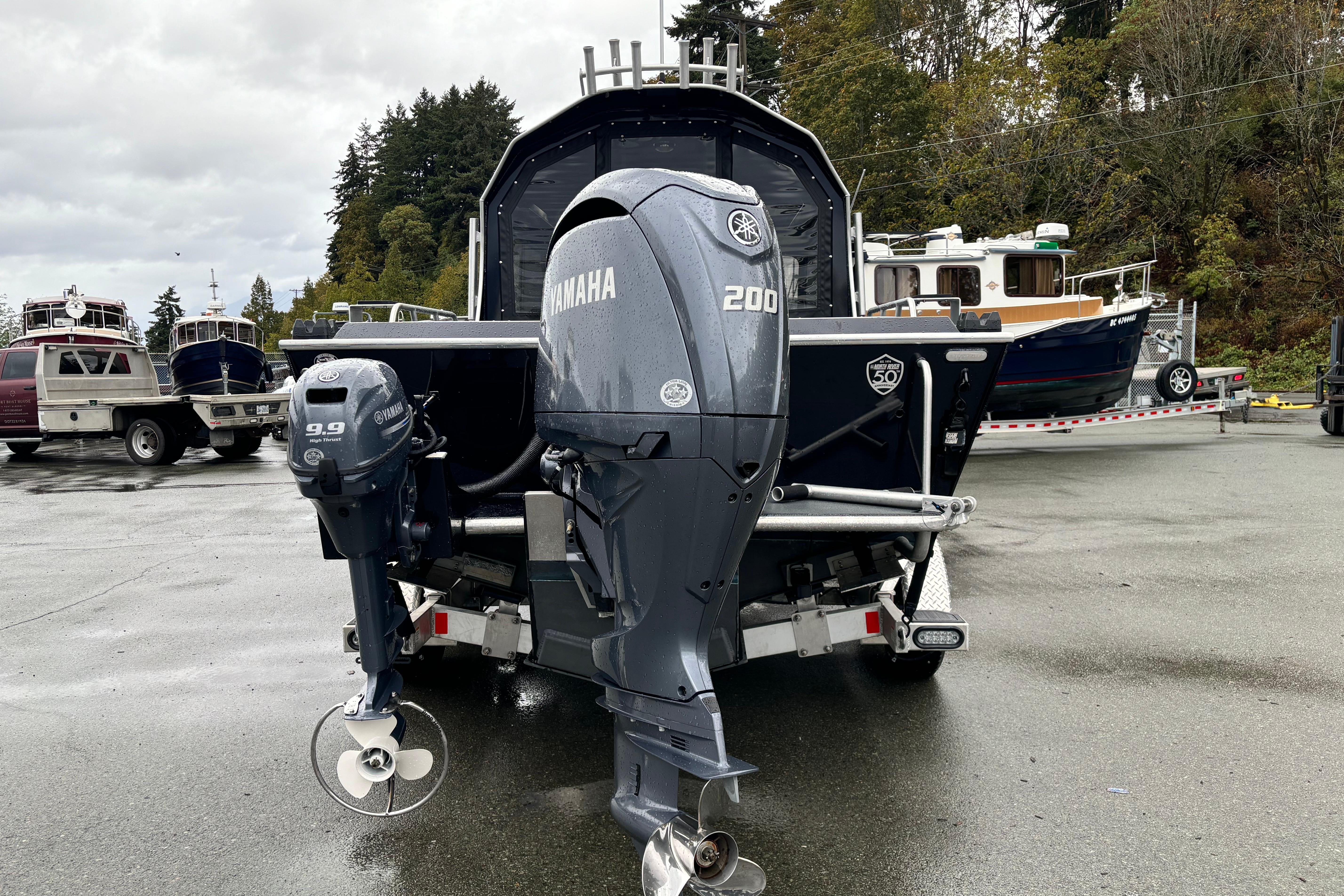 2024 North River 21 Fastback with Yamaha outboard motors in a marina setting.