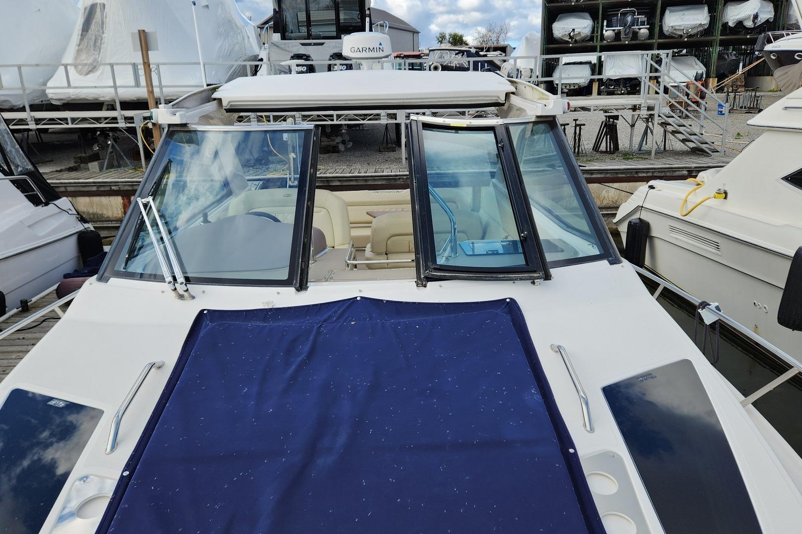 2018 Regal 35 Sport Coupe yacht docked, featuring sleek design and spacious cockpit.