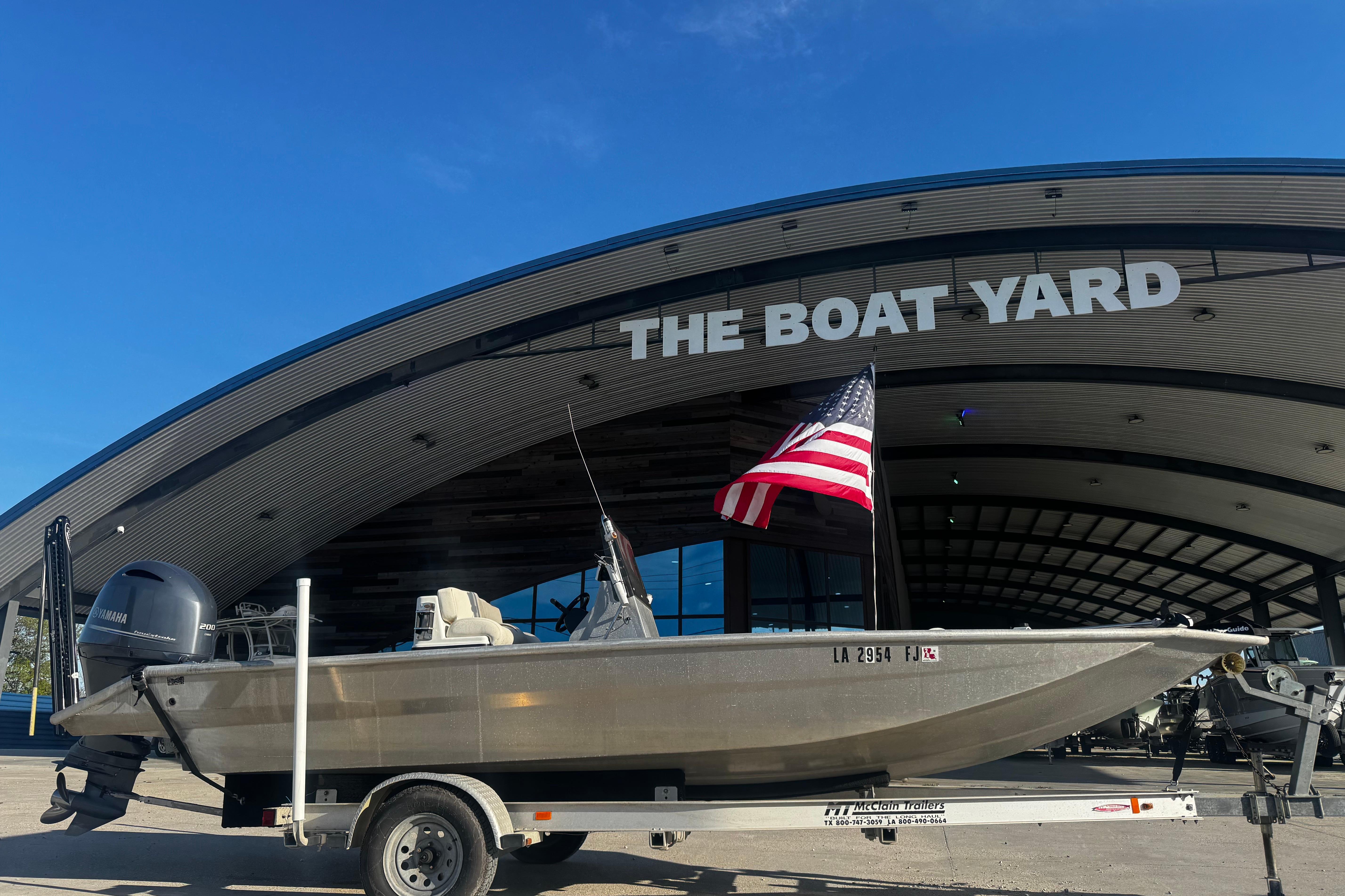 Custom Charles Leonard 21 boat from 2004 at The Boat Yard with American flag.