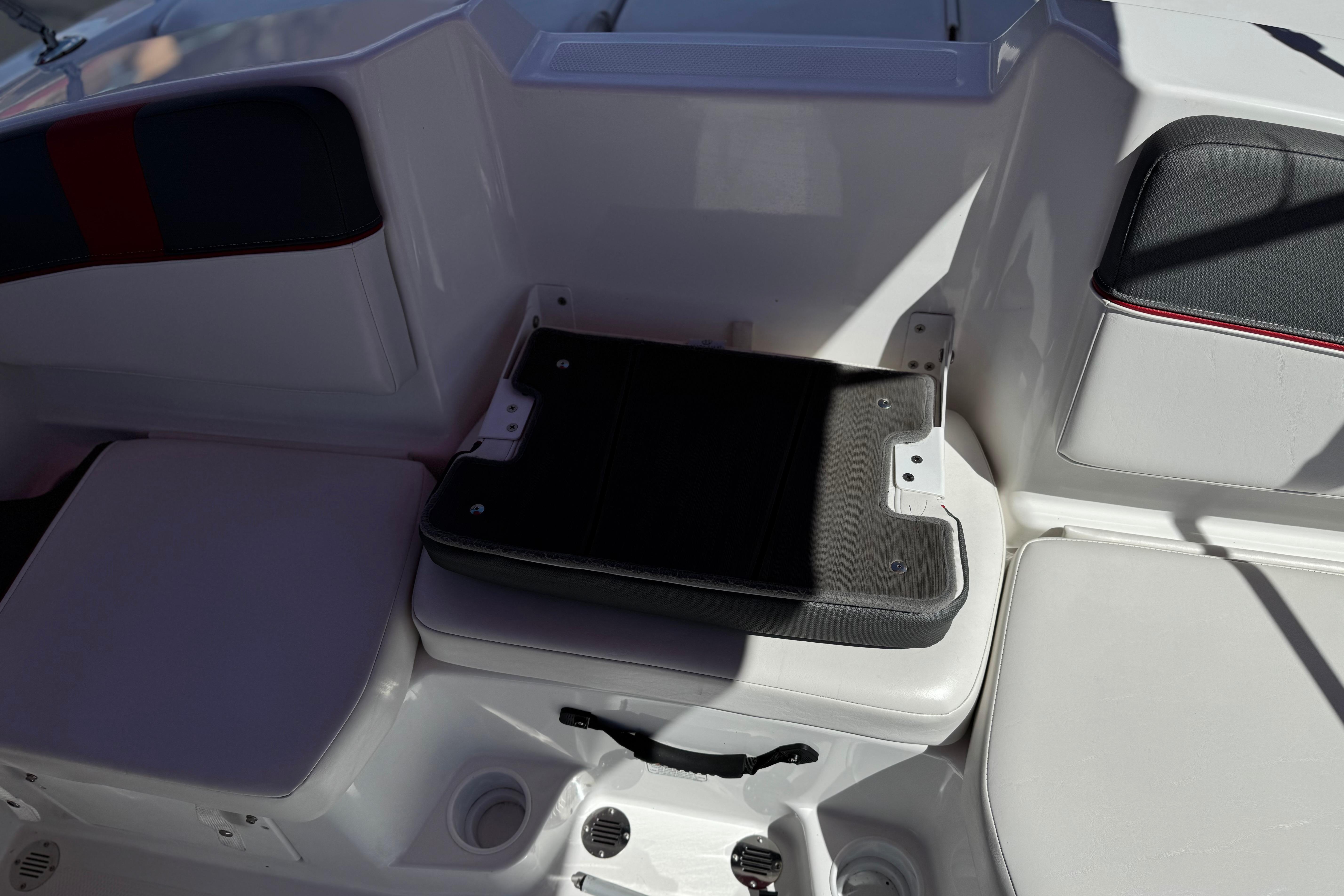 2024 Tahoe T16 boat interior seating with storage compartment.