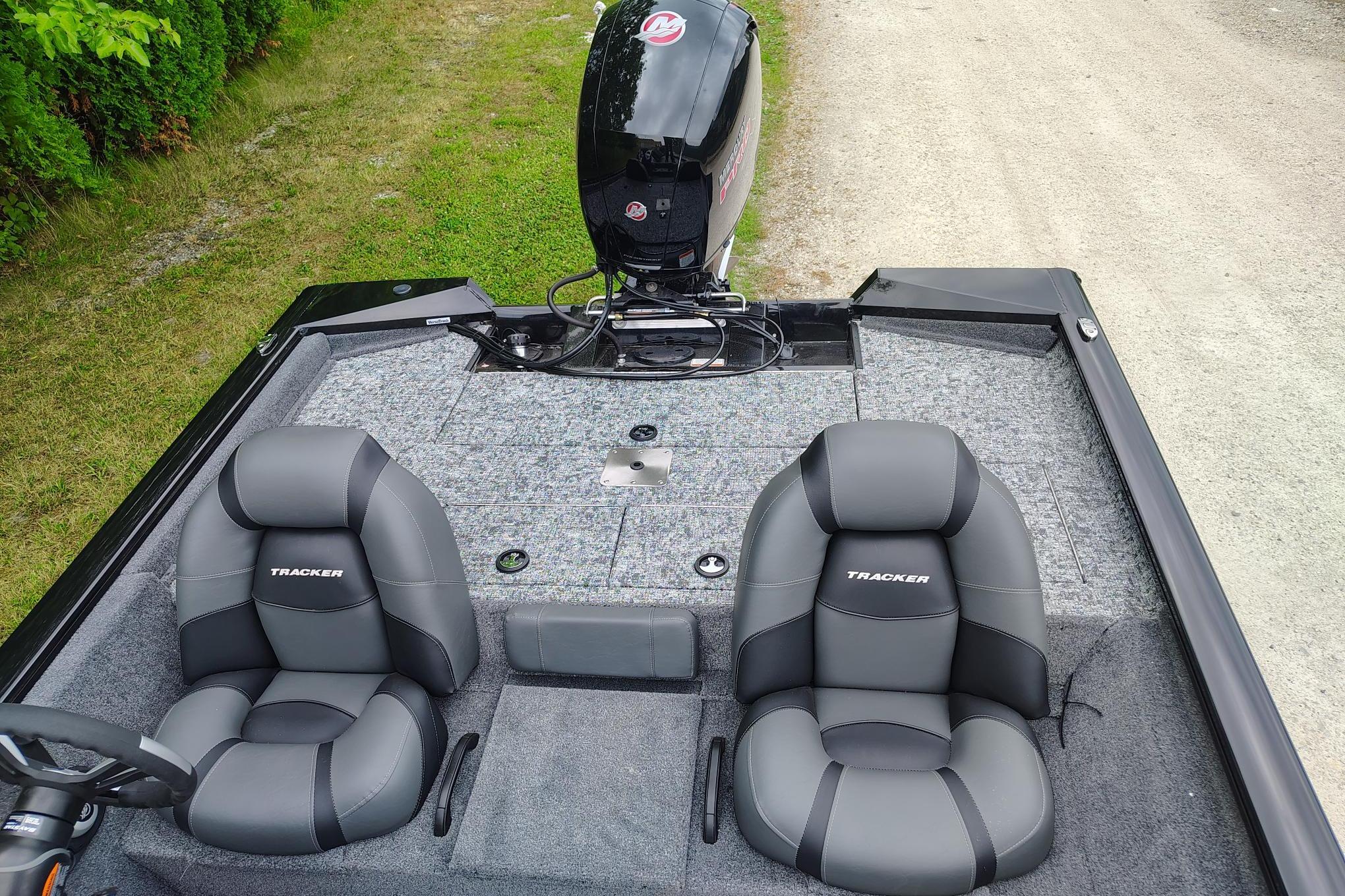 2026 Tracker Pro Team 195 boat interior with two gray seats and motor.