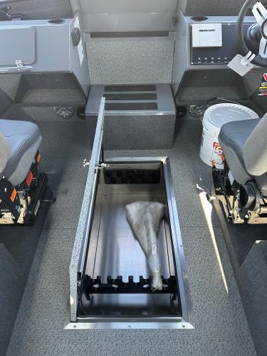 2024 Spartan 260 Maximus Pro XL boat interior with open storage compartment.