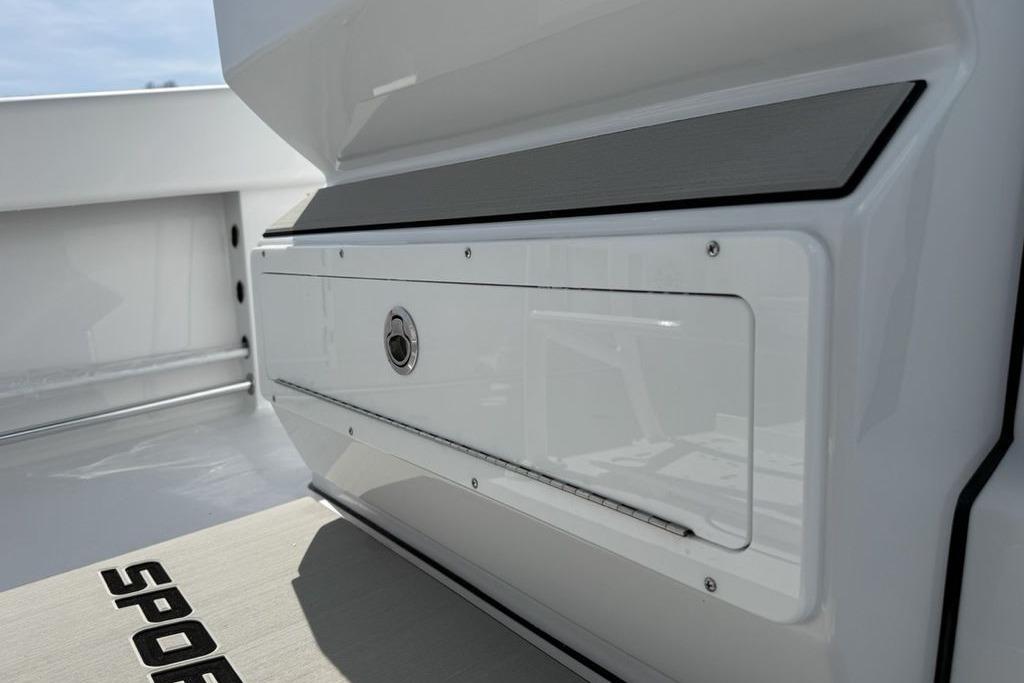 2026 Sportsman Open 252 Center Console boat interior detail, featuring sleek storage compartment.