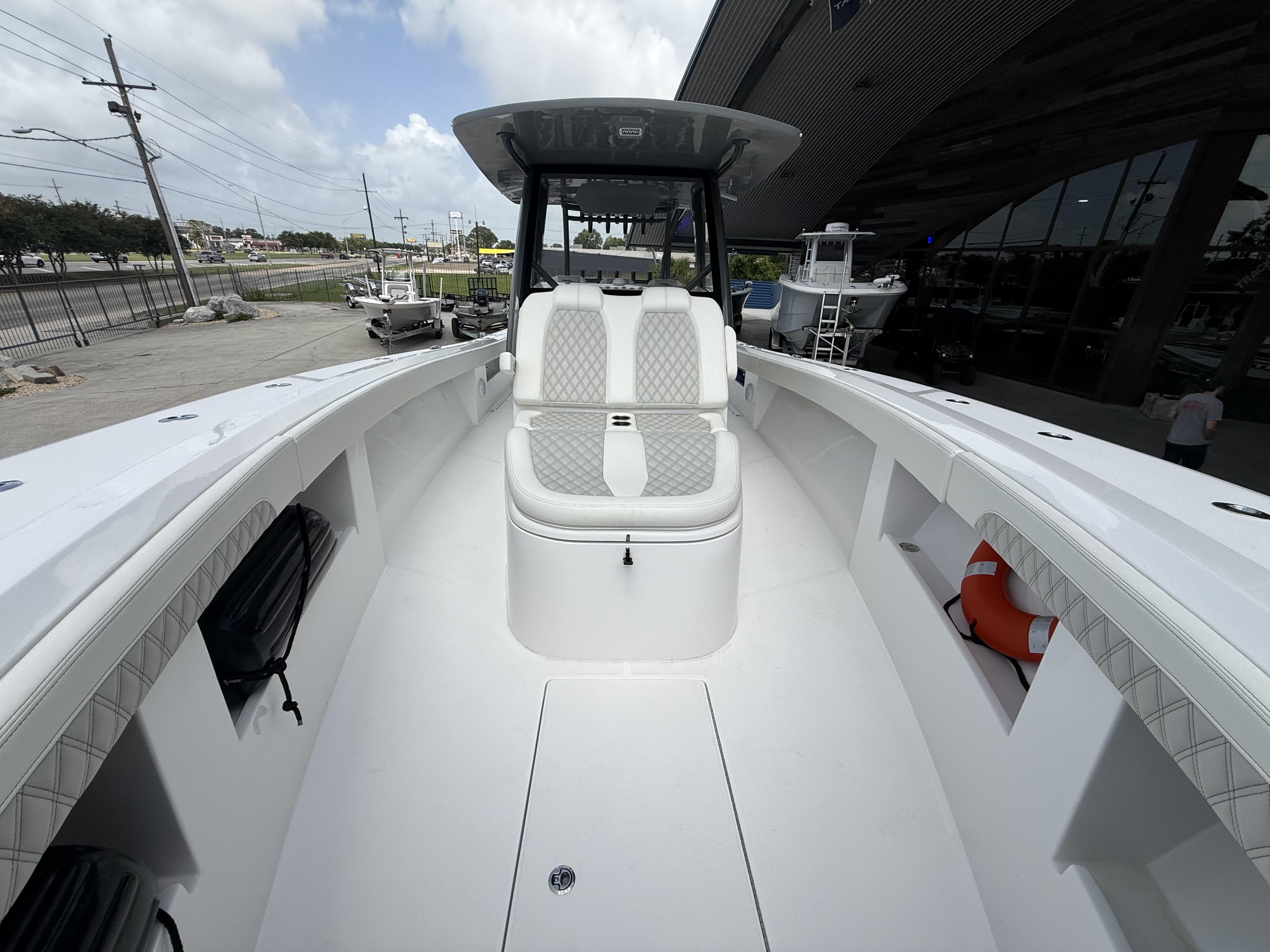 2024 Front Runner 39 CC boat interior with cushioned seating and storage compartments.