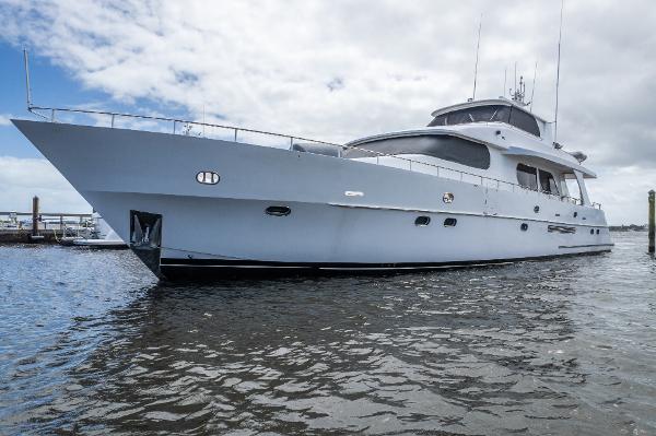 Grand Harbour 76 yacht, 2001 model, docked on a cloudy day.