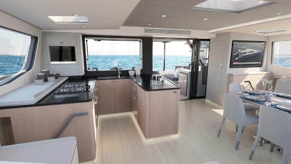 Luxurious interior of 2025 Privilege Signature 580 yacht with modern kitchen and dining area.