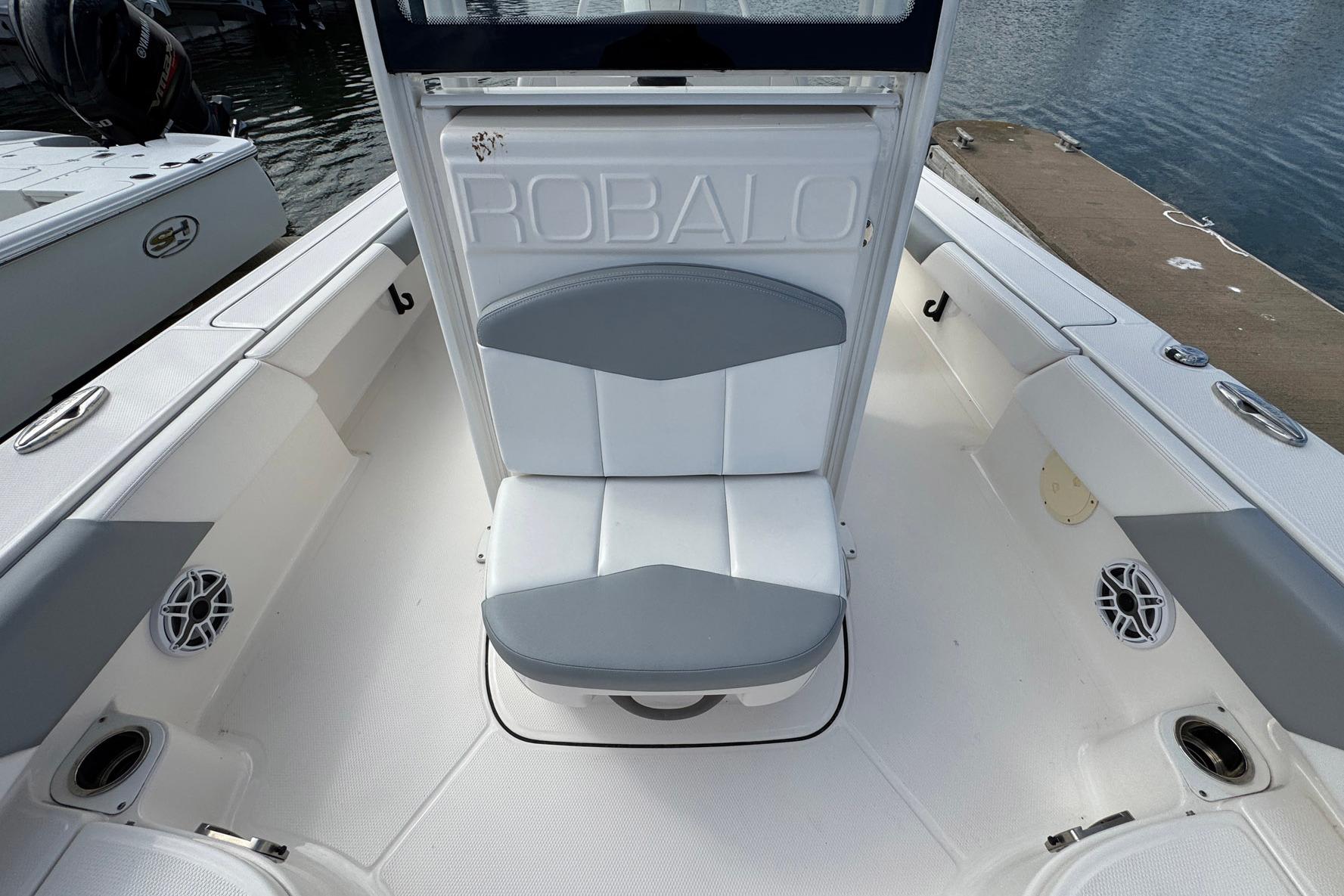 2021 Robalo 246 Cayman boat interior with seating and speaker details.
