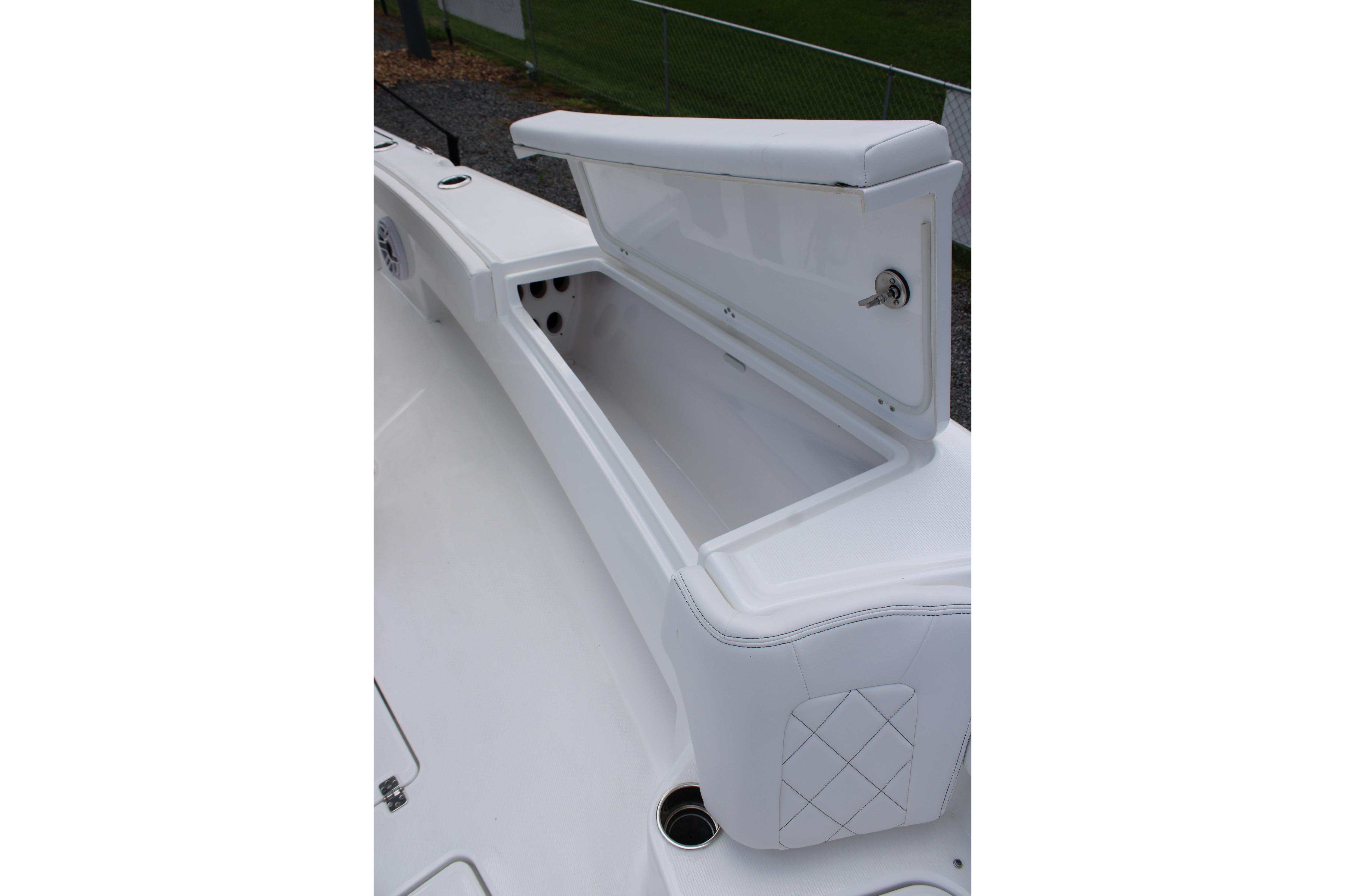 Open storage compartment on 2027 Blazer Bay Makaira 2800 boat, showcasing sleek design.