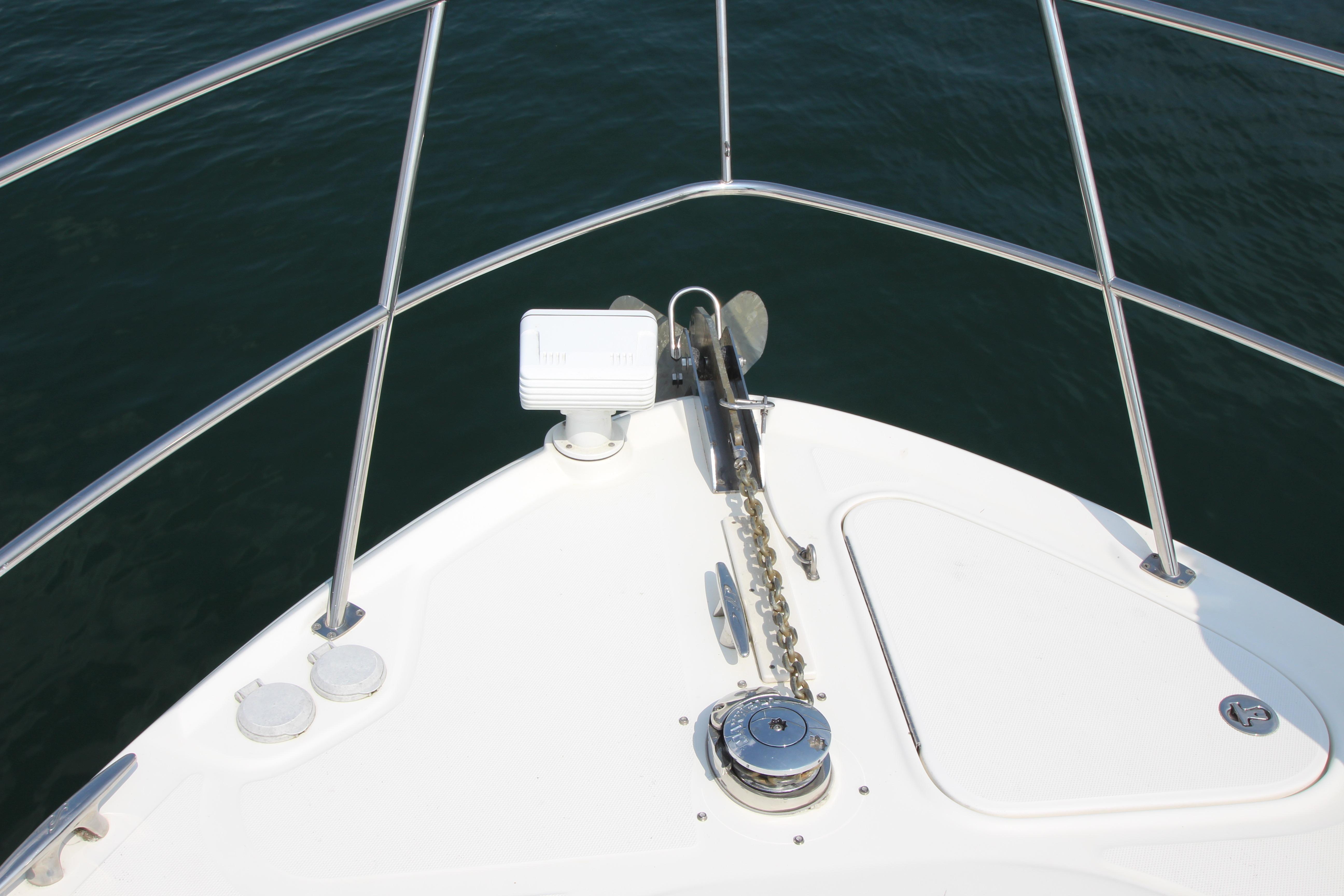 Bow of 2004 Sea Ray 40 Sundancer yacht with anchor and railing.