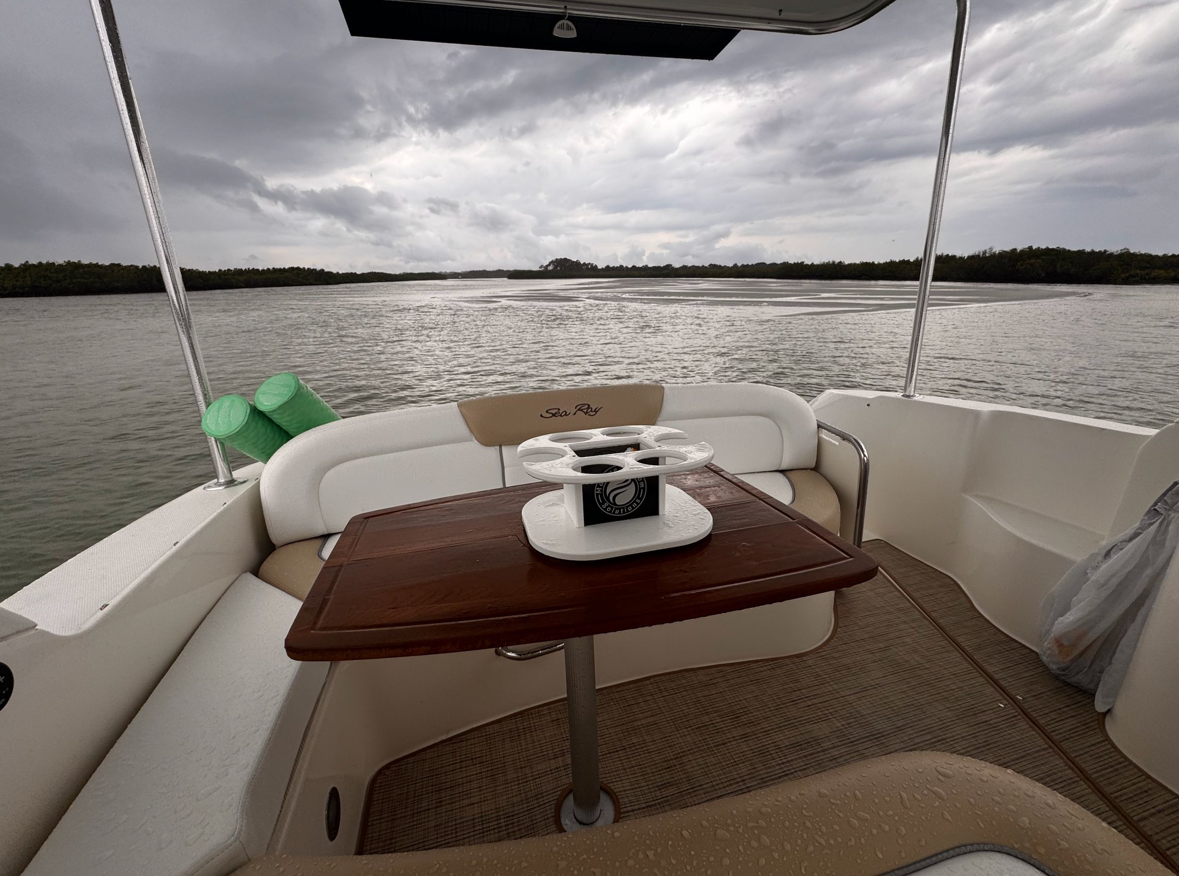Interior of a Sea Ray Sundancer 310 yacht, overlooking the water.