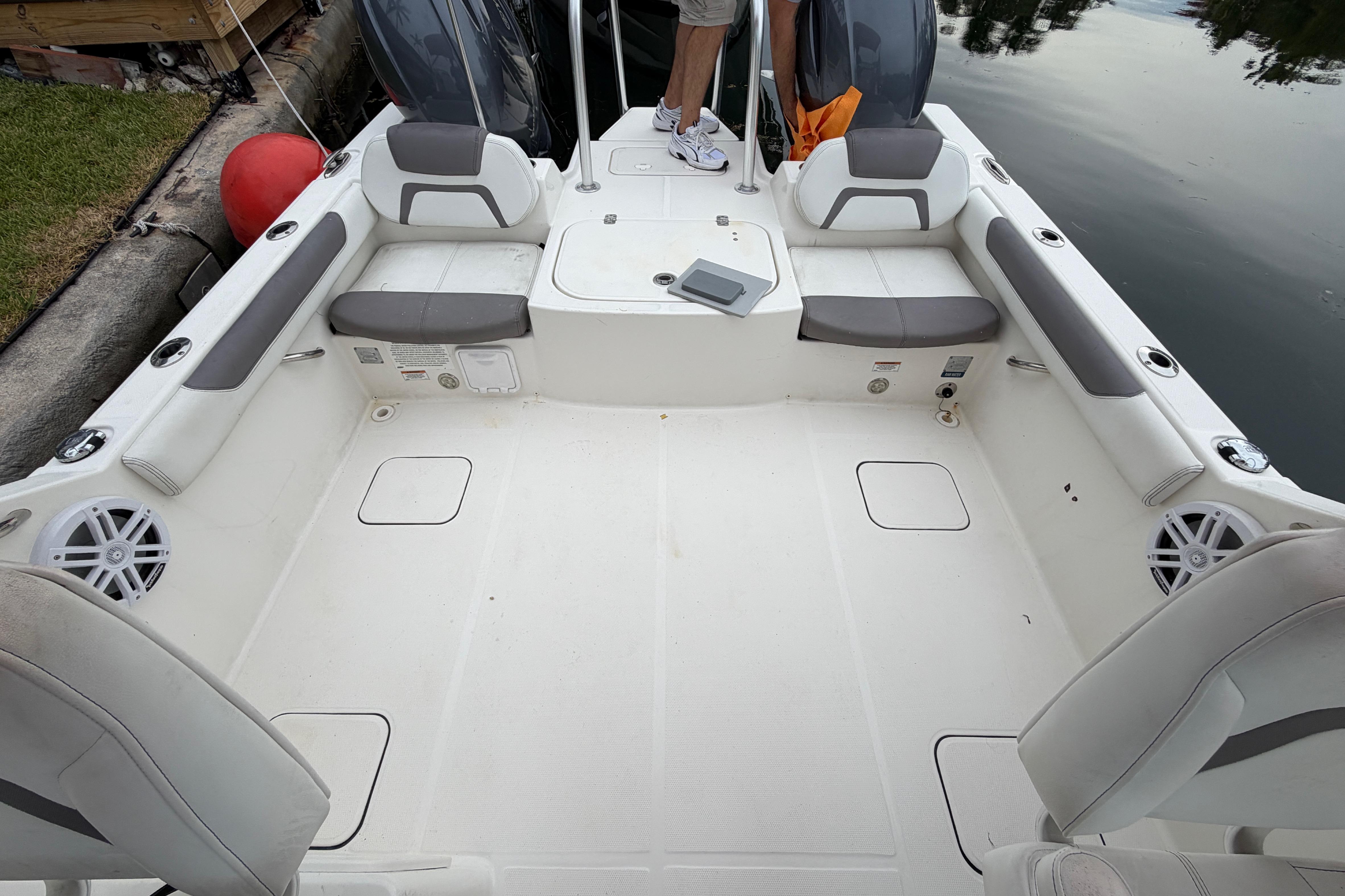 2019 World Cat 230 DC boat interior with seating and storage compartments.