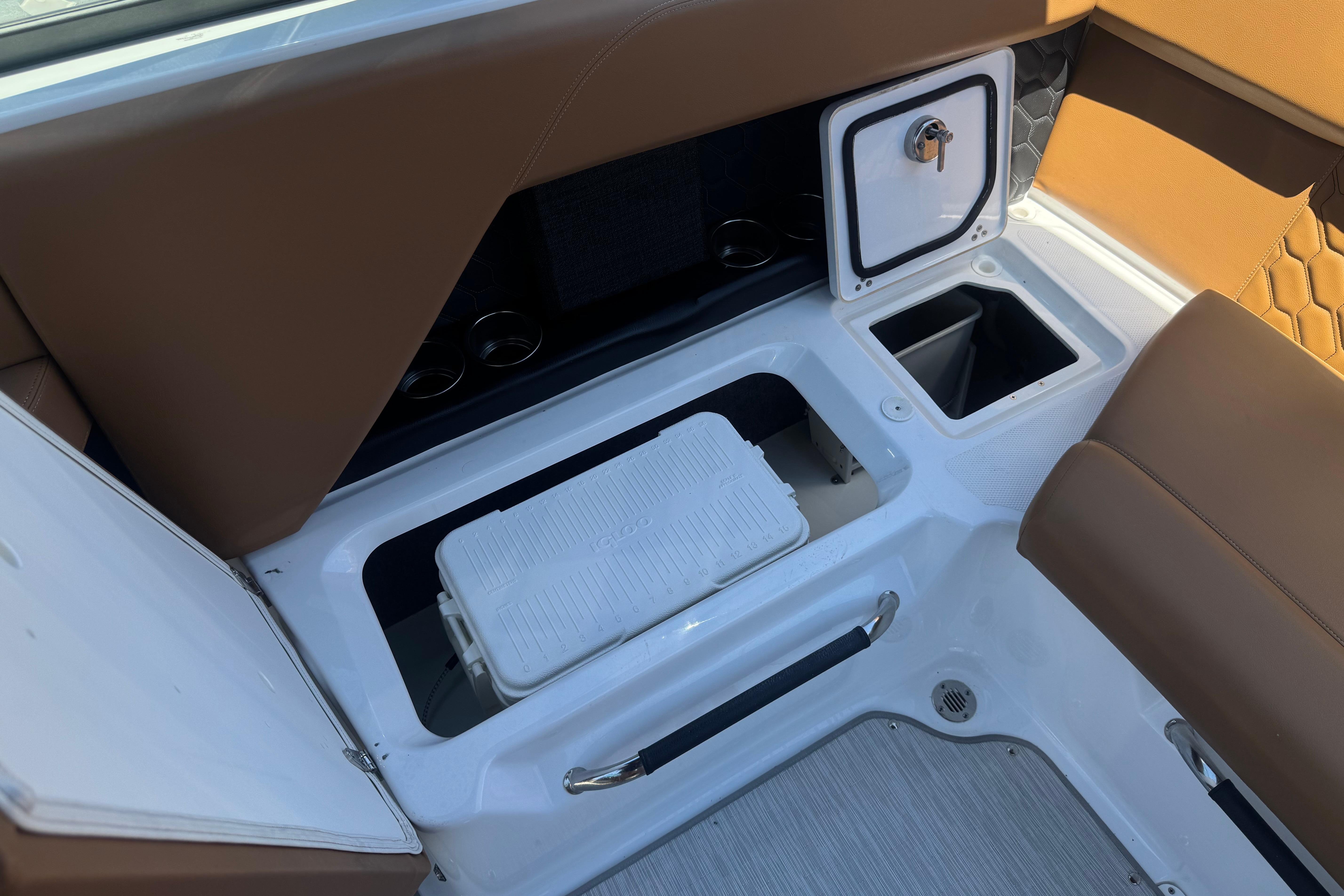 Interior of 2022 Four Winns H4 boat with storage compartments and seating.