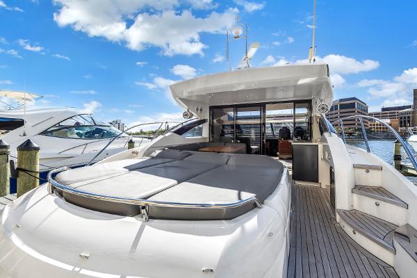 2013 Princess V57 luxury yacht docked at marina.