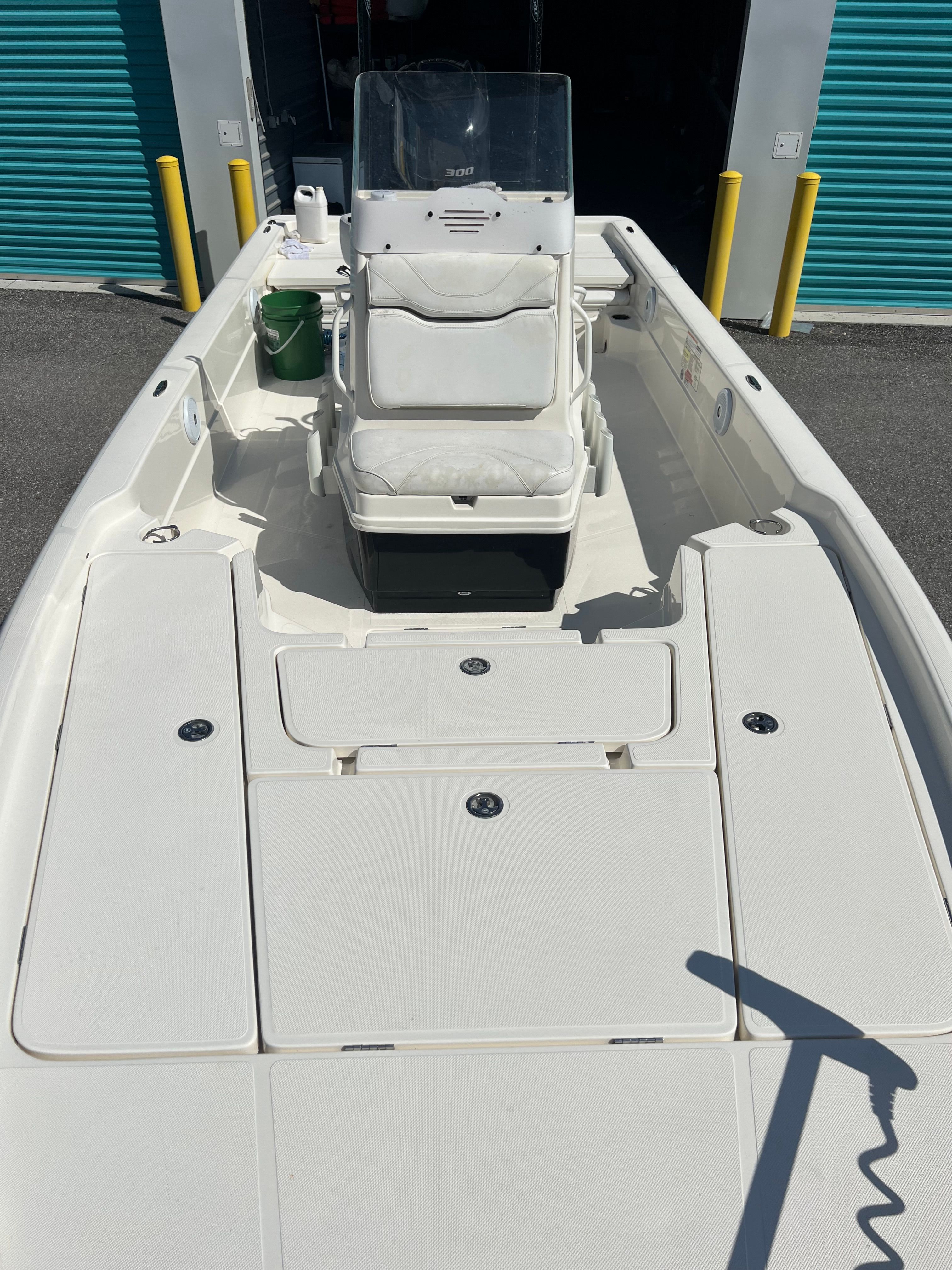 A 2020 Skeeter SX240 boat with a central console and storage compartments on the deck.