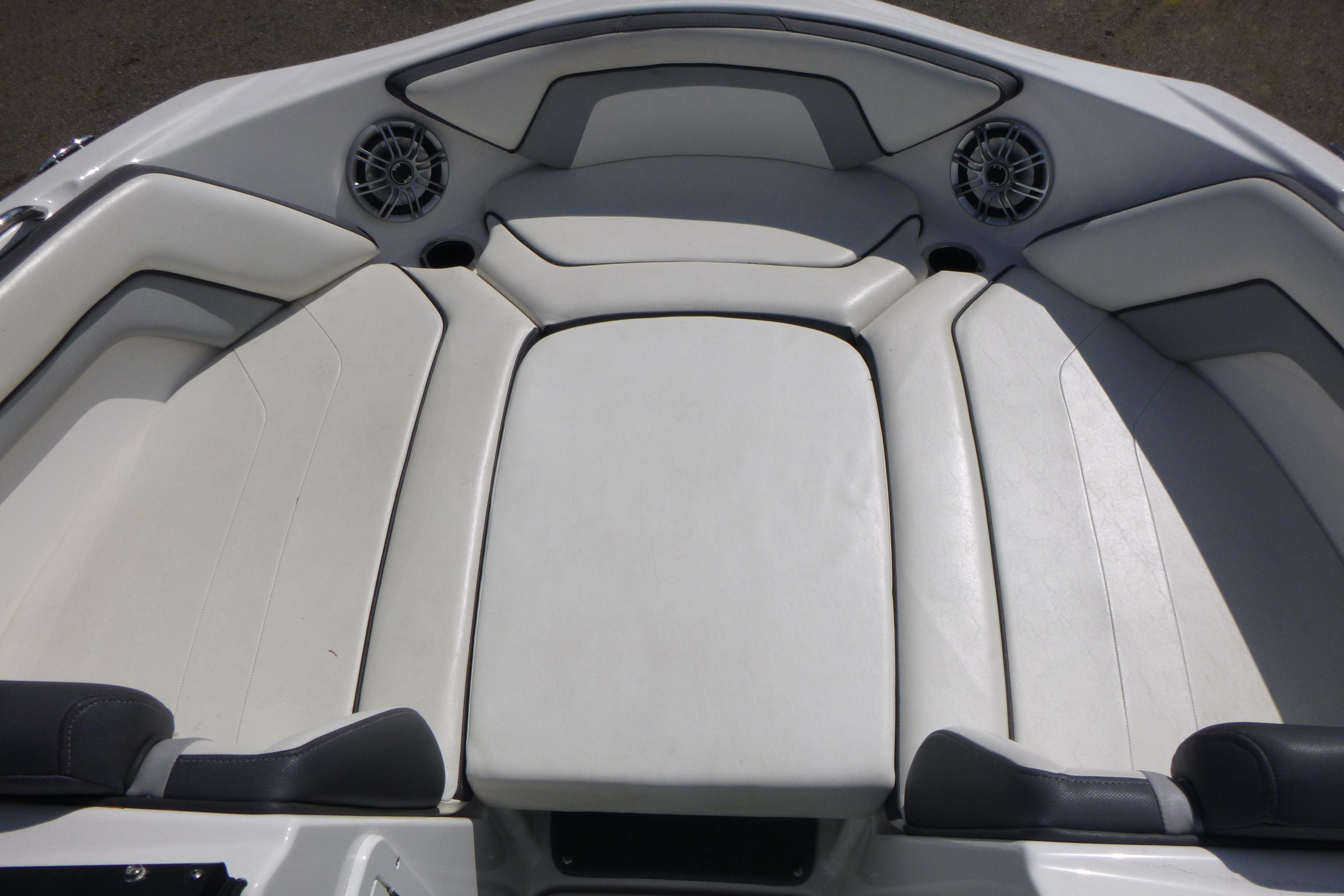 2015 Yamaha Boats SX192 interior seating with white upholstery and built-in speakers.