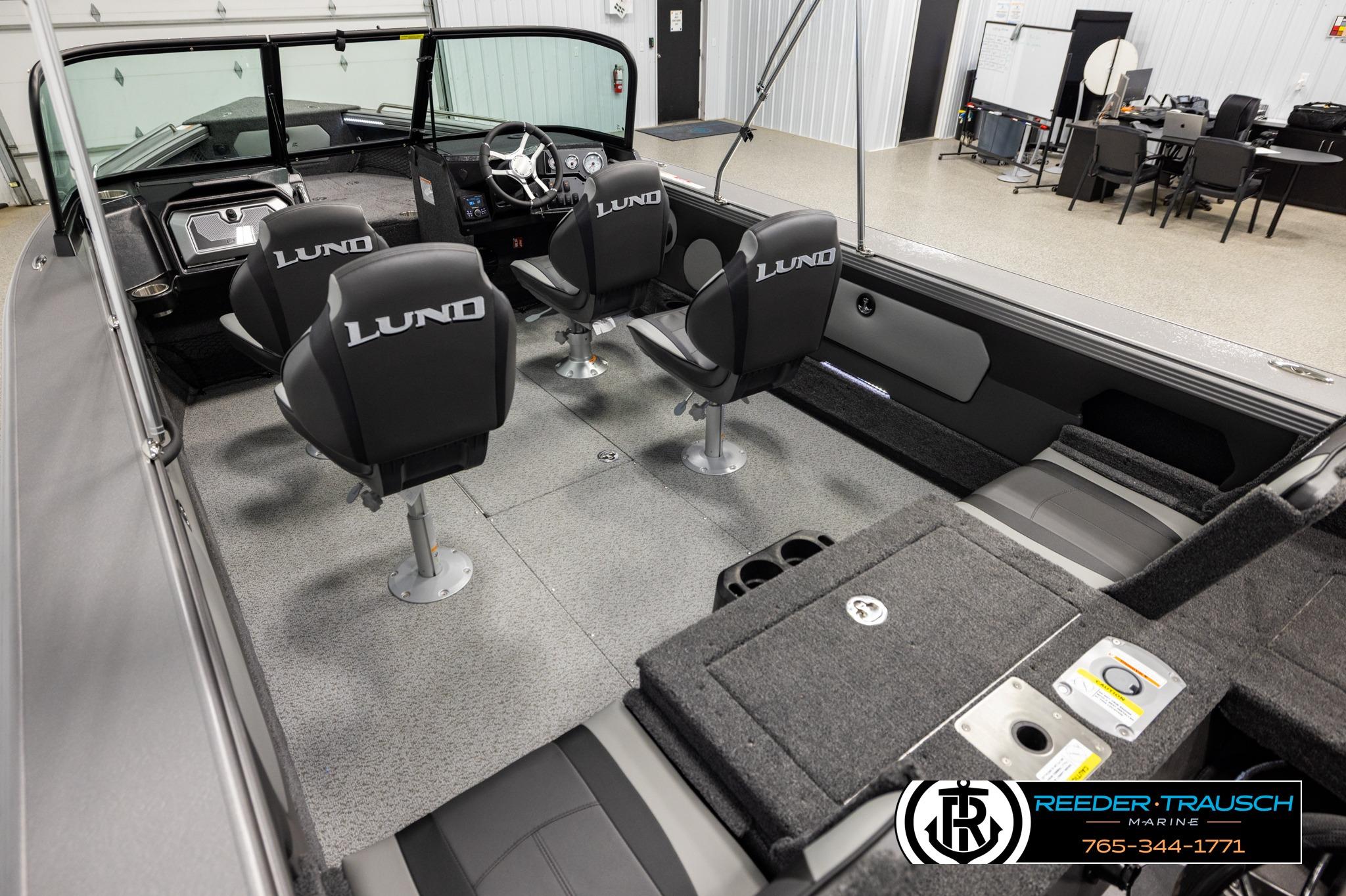 Interior of 2026 Lund 1975 Tyee boat with four seats and modern dashboard.