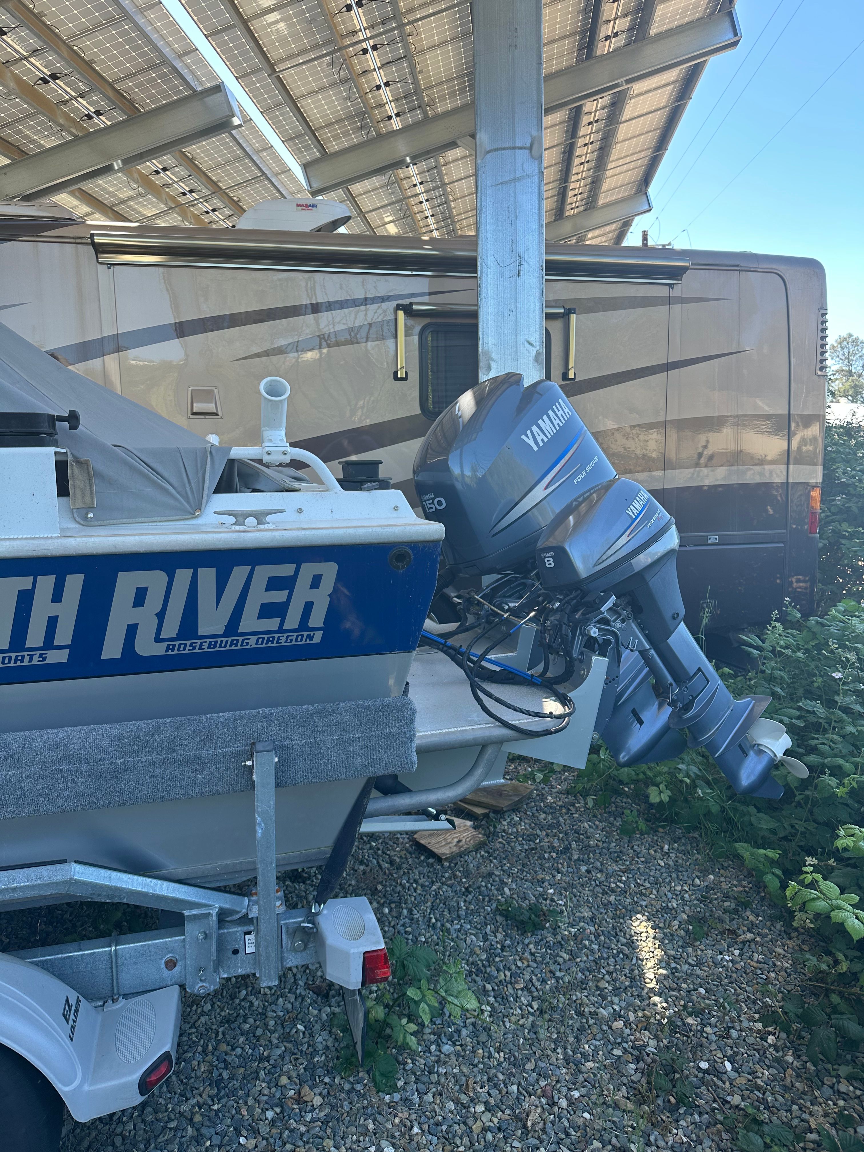 A 2006 North River aluminum boat with a Yamaha outboard motor.