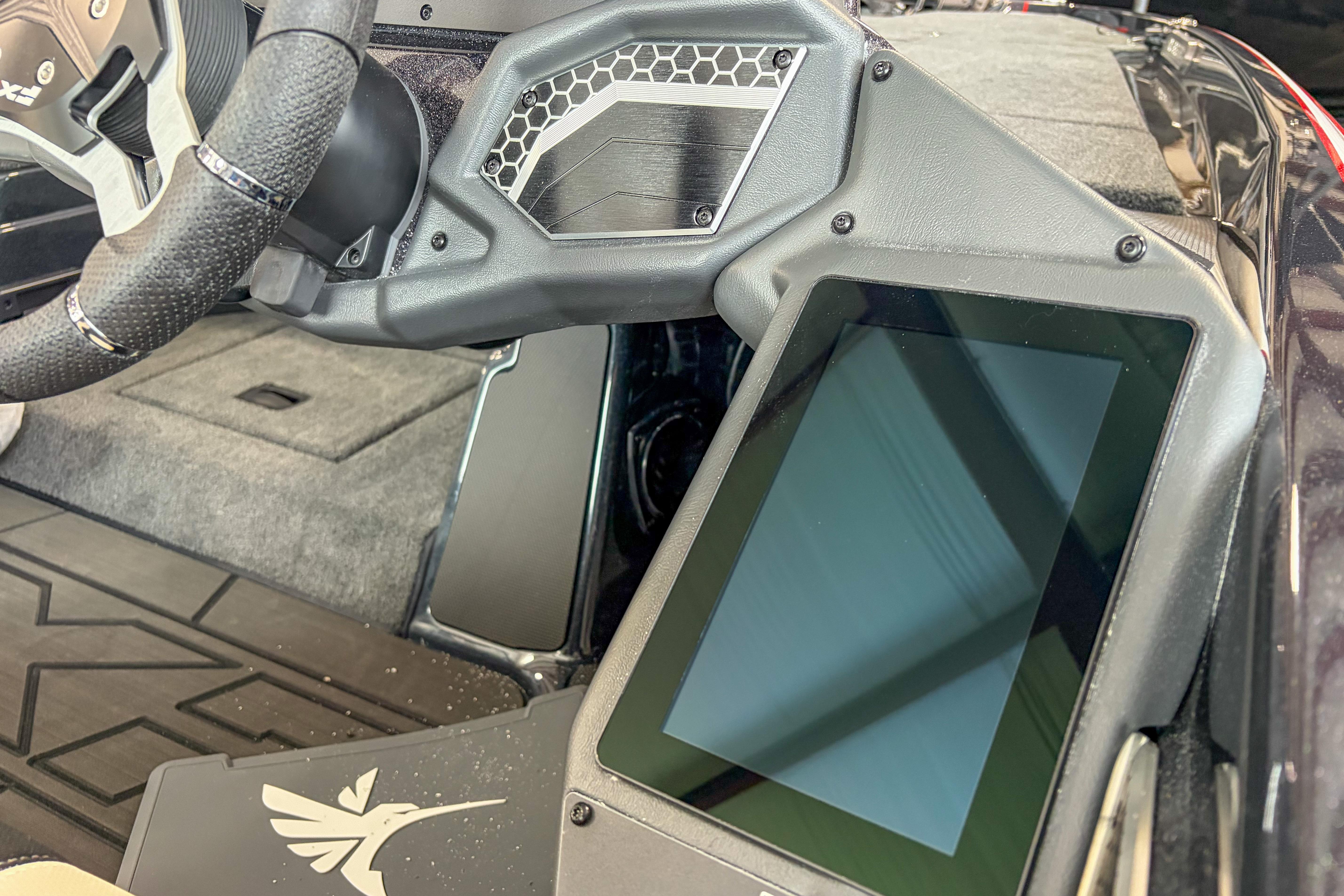 2026 Skeeter FXR20 FLEX boat dashboard with touchscreen display and steering wheel.