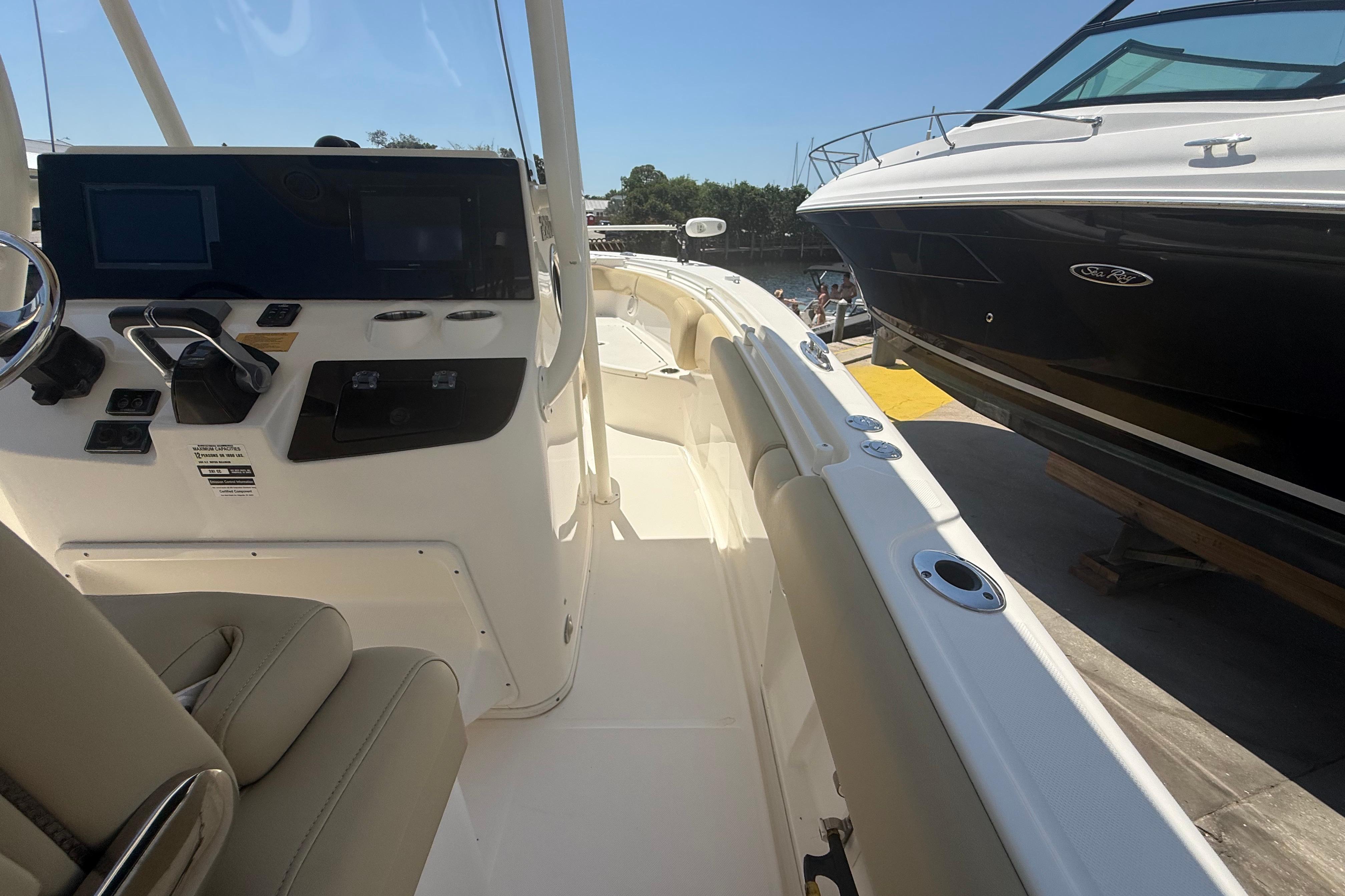 2019 Key West Billistic 281 Center Console boat interior with control panel and seating.