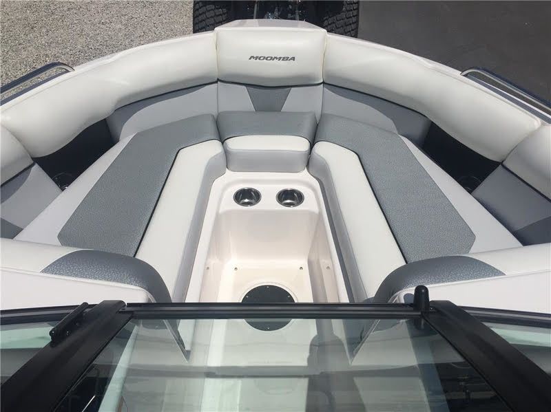 The image shows the bow area of a Moomba Mondo boat with gray and white upholstery.