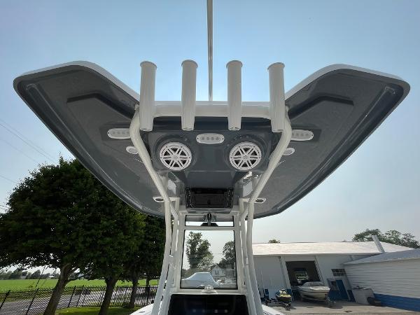 2025 Tidewater 232 CC Adventure boat T-top with rod holders and speakers.