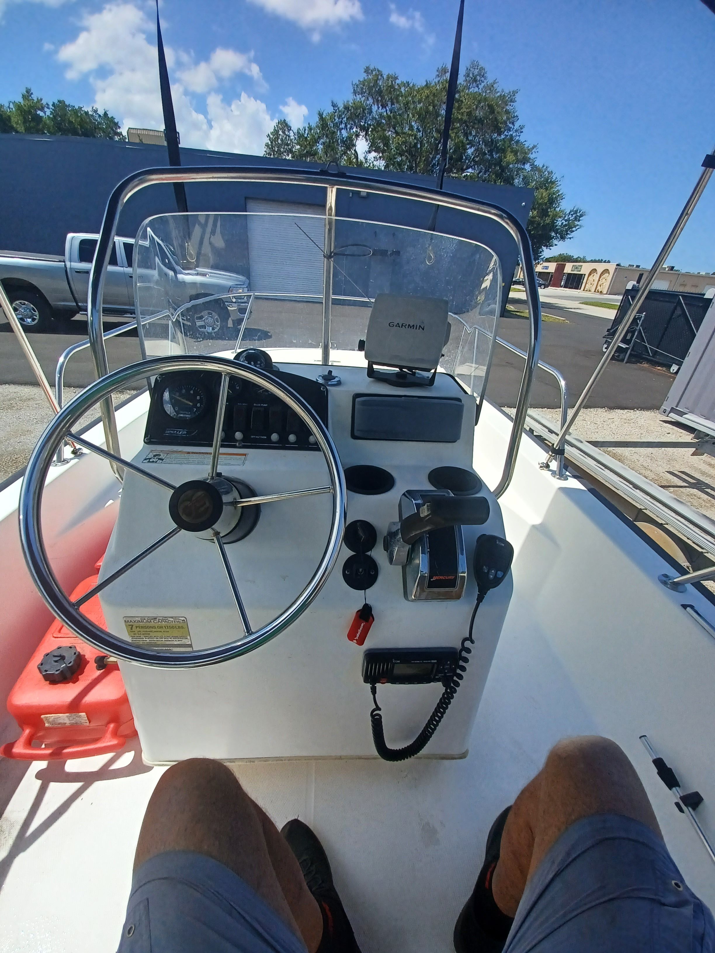 The image shows the helm of a 2008 Boston Whaler 170 Montauk with navigation equipment.
