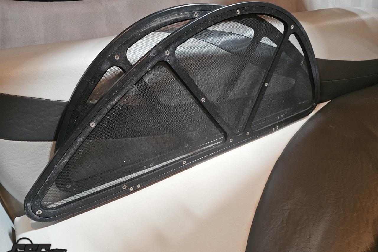 Mesh windscreen on 2008 Baja 335 Performance boat seat, featuring black and white upholstery.