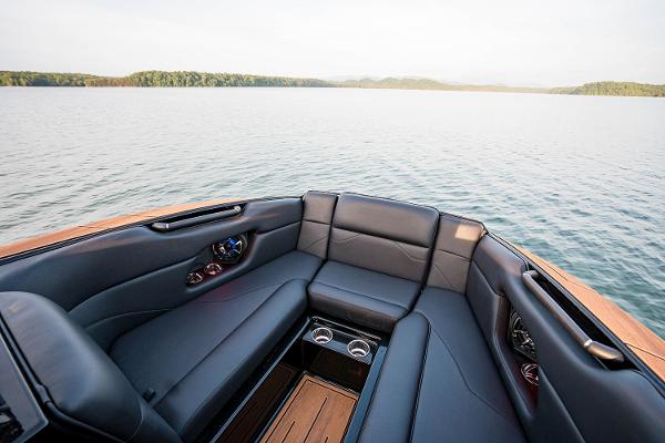 Manufacturer Provided Image: 2025 Moomba Mojo boat interior with luxurious seating on a serene lake.
