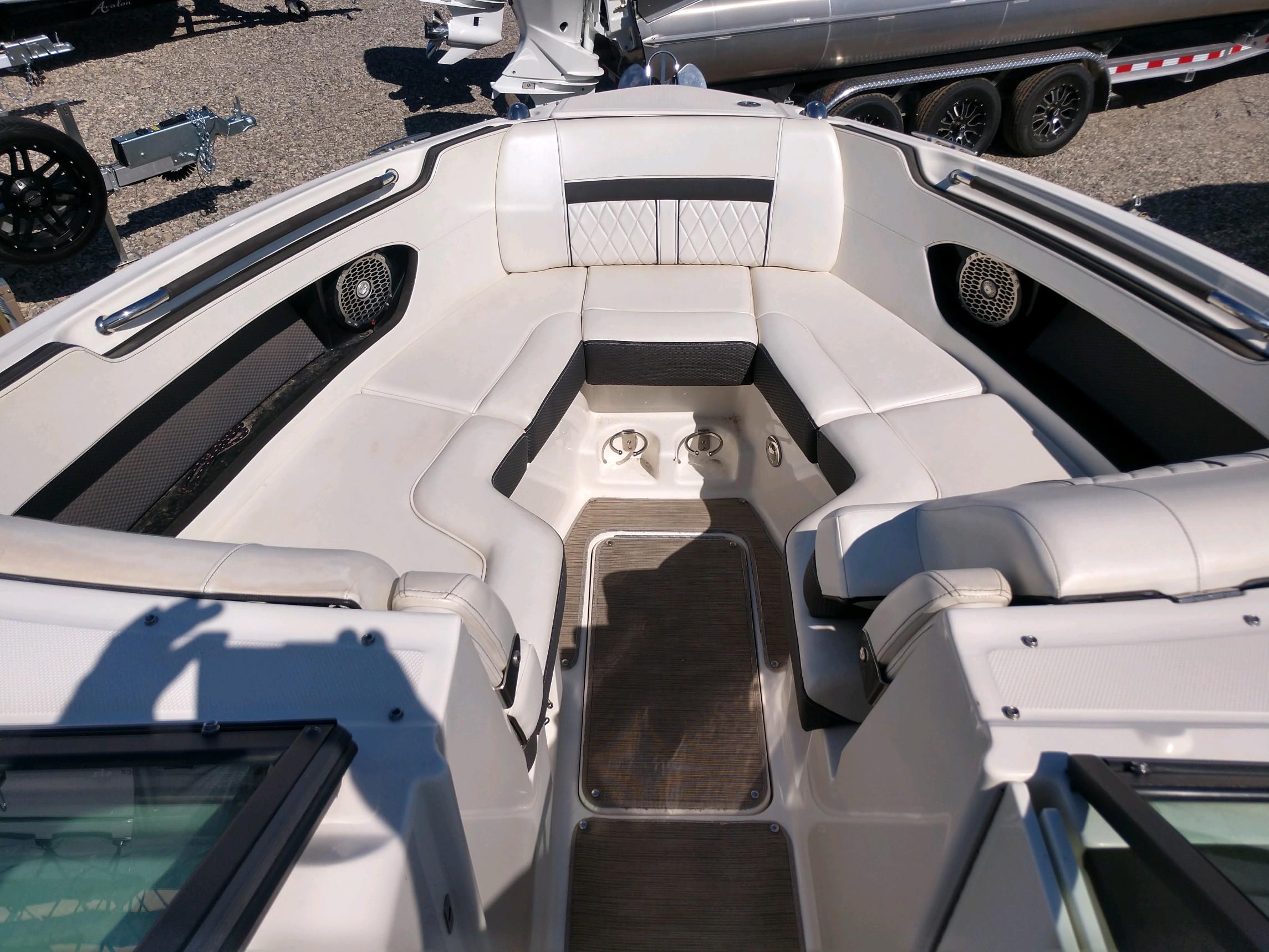 2018 Sea Ray SLX 280 boat interior with white leather seating and stainless steel accents.