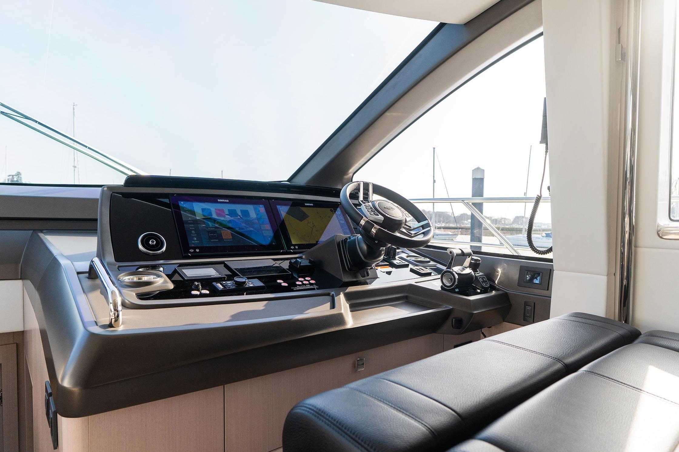 Helm of 2026 Sunseeker Manhattan 68 yacht with modern controls and navigation screens.