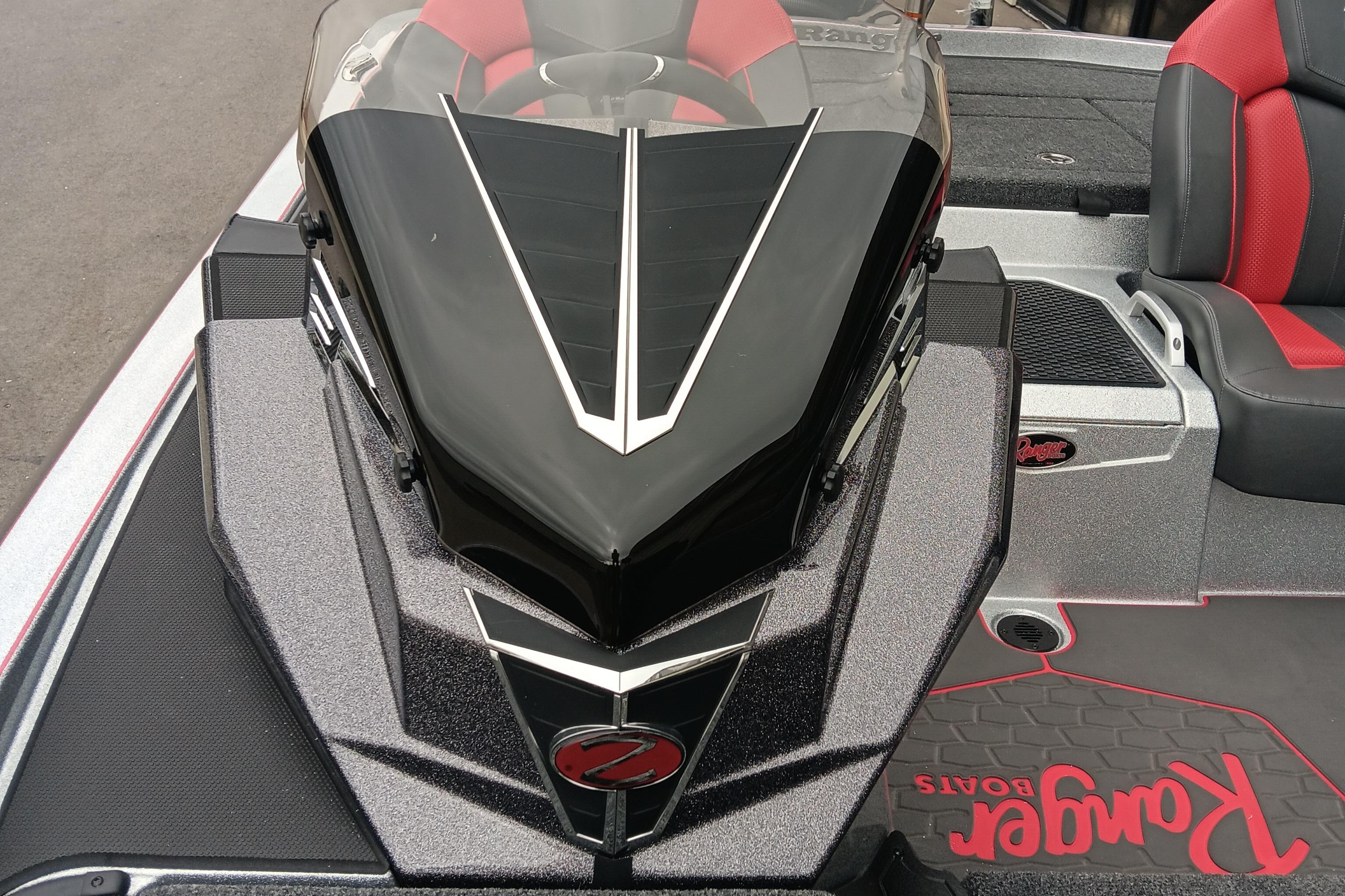 2026 Ranger Z520 boat interior with sleek black and red design, featuring comfortable seating.
