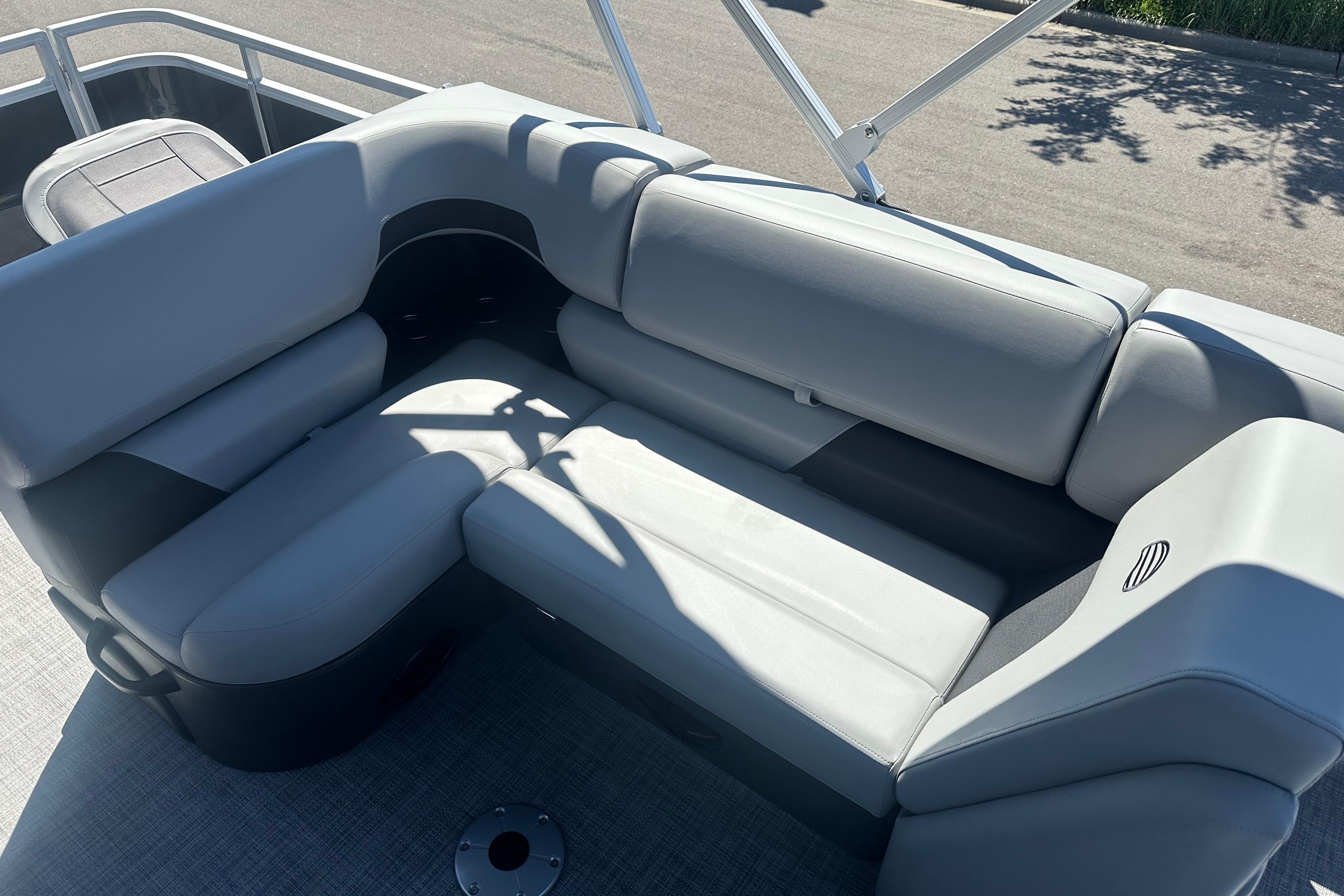 2026 Sun Tracker SportFish 22 DLX boat interior with comfortable gray seating.