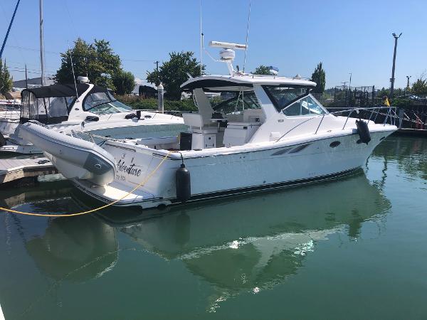 2003 Tiara Yachts 3500 Open docked in a marina on a sunny day.