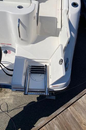 2024 Robalo R222 Center Console boat with swim ladder and storage compartments.
