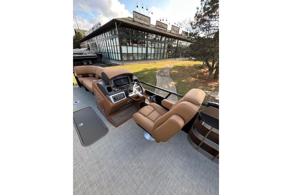 Luxurious 2025 Regency 230 LE3 Sport boat interior with plush seating and modern dashboard.