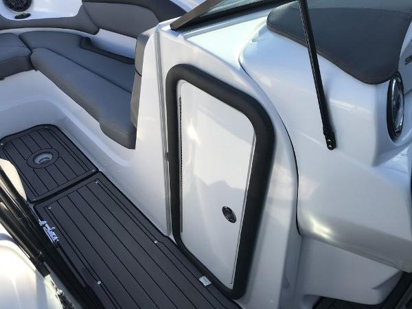 2020 Rinker 29QX BR boat interior with seating and storage compartment.