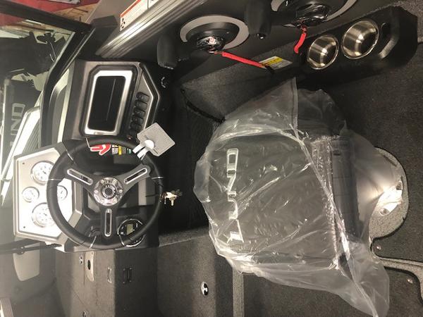 2024 Lund 2075 Tyee boat interior with steering wheel and controls.