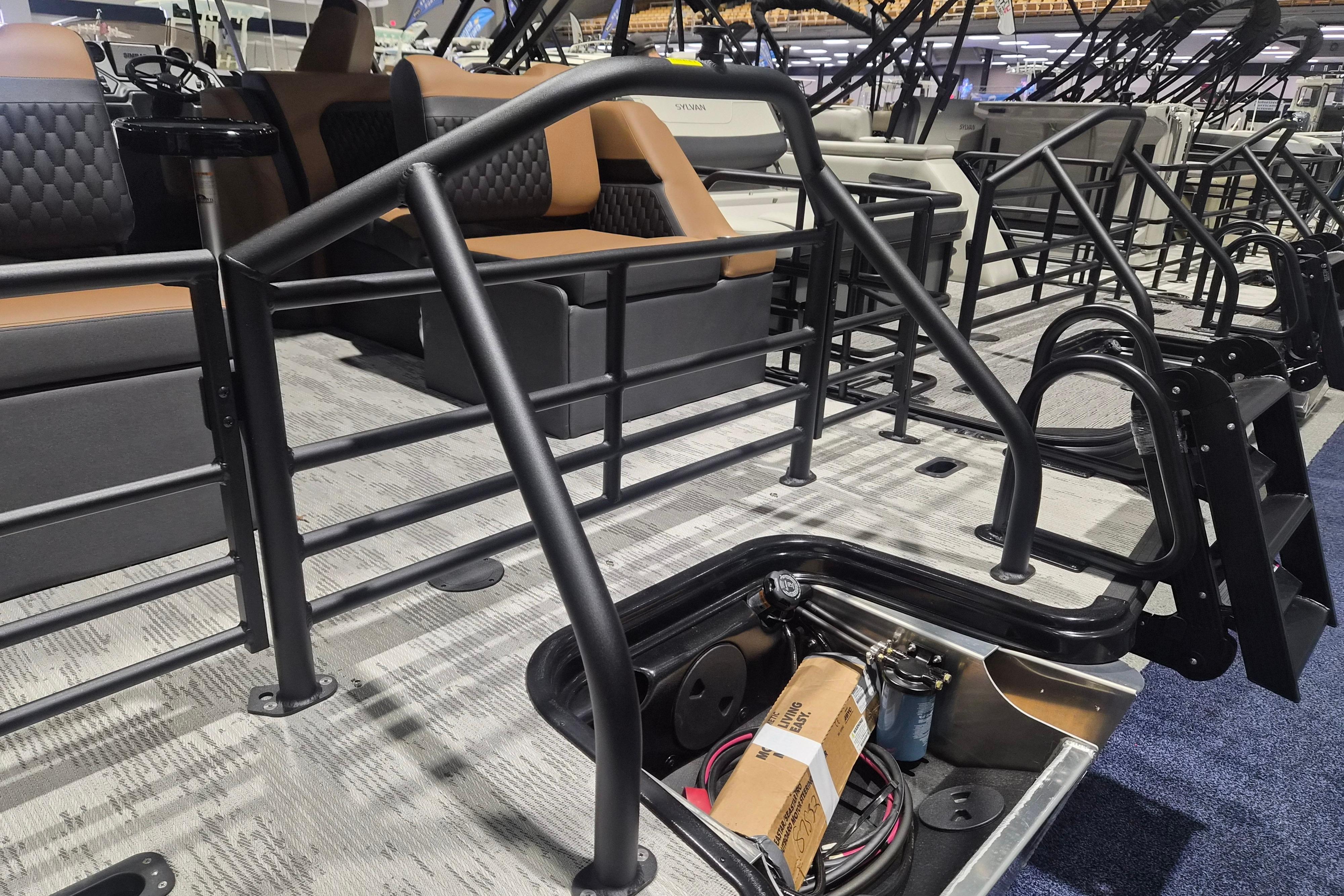 2026 Sylvan L3 SLZ pontoon boat interior with seating and storage compartment.