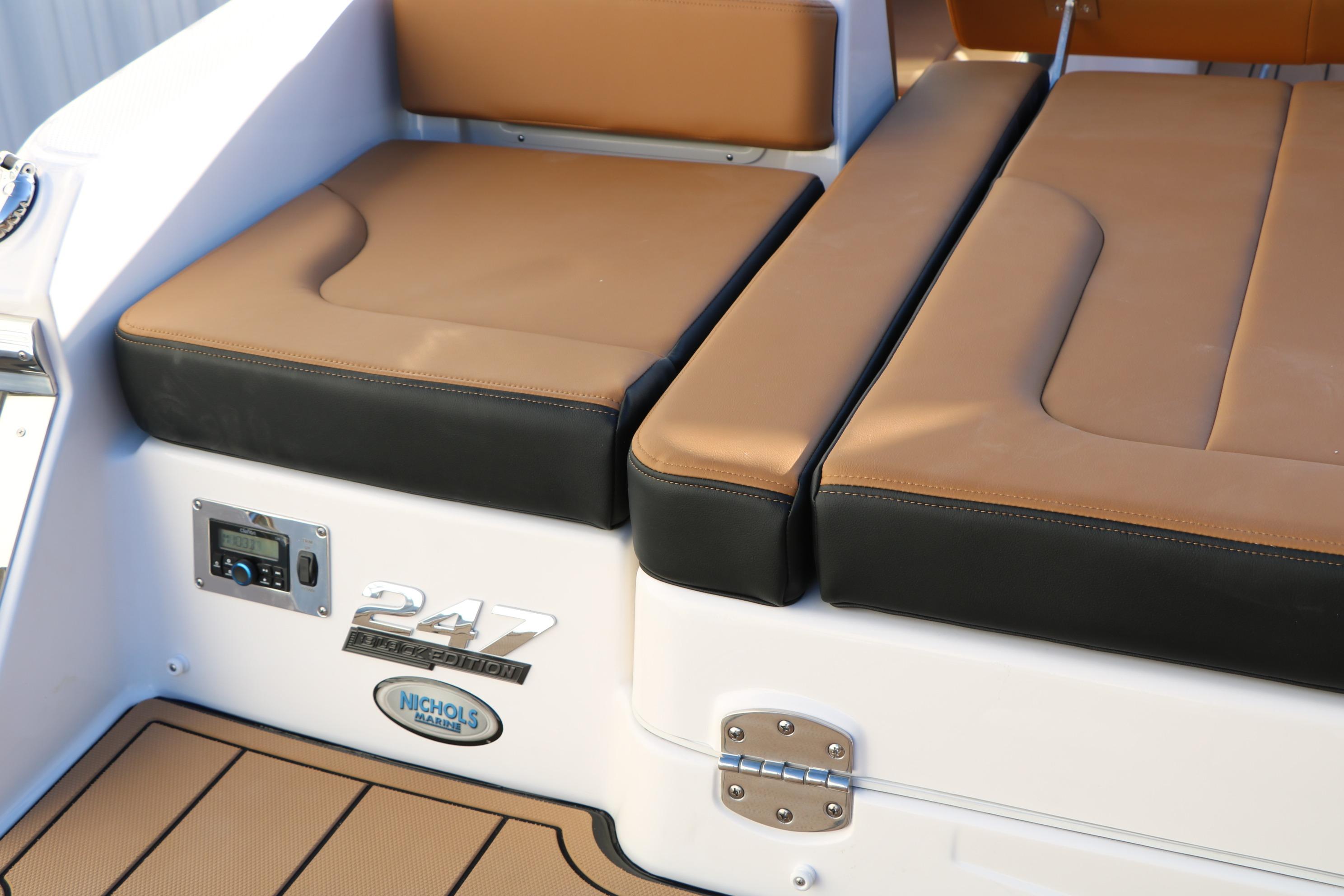 2026 Chaparral 247 SSX boat seating with brown and black cushions.