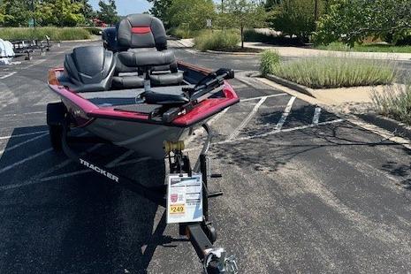2026 Tracker Pro Team 175 Crappie Edition boat parked in a lot, featuring sleek design and seating.